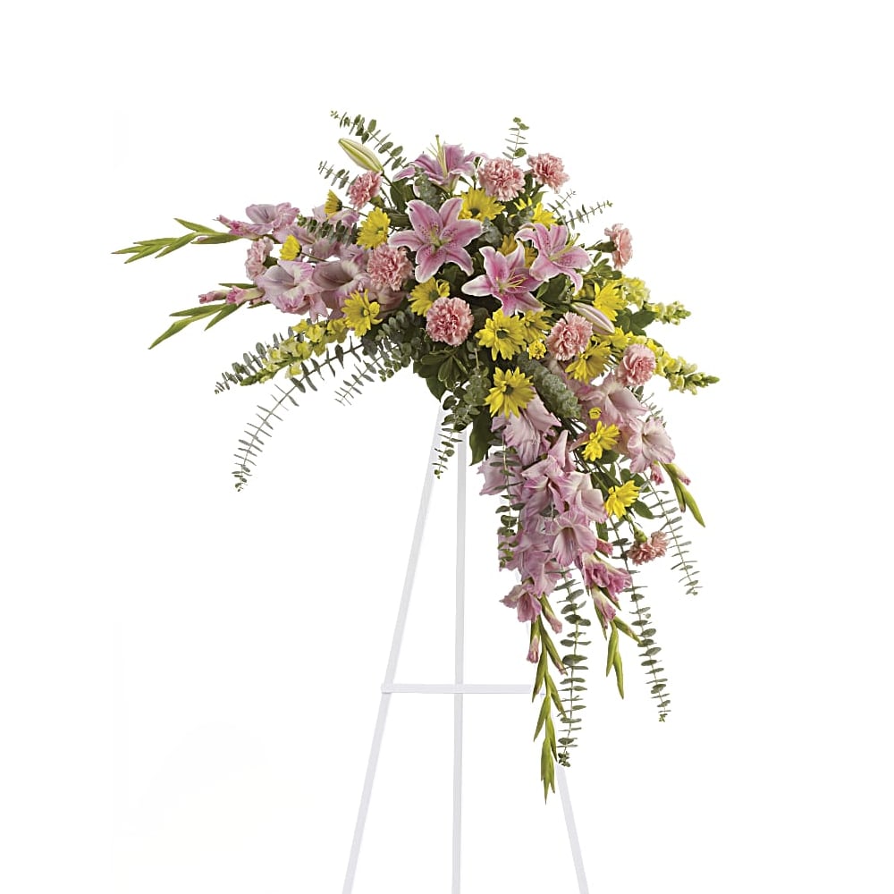 Sweet Solace Spray Sweet Solace Spray - Soft, soothing pink lilies and yellow daisies are crafted into a crescent standing spray - what a lovely remembrance of your friendship, and perfect selection for a memorial service.
