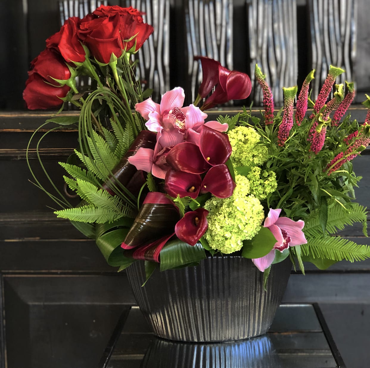 Veronica  - An arrangement of red roses, beautiful calla lilies, veronicas, and orchids prefect for  Anniversary, Valentin's Day or Birthday.
