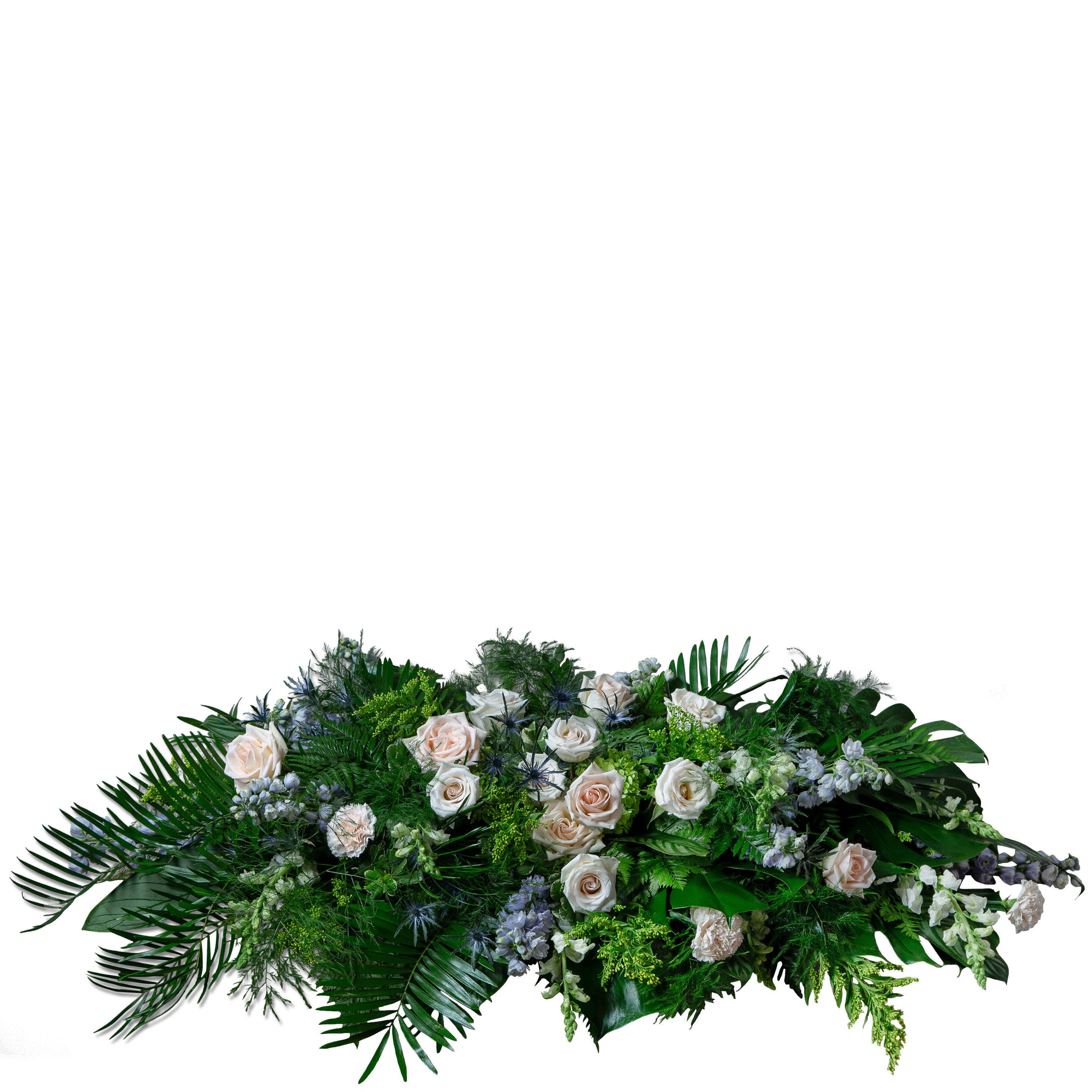 Heartfelt Rememberance Casket Spray - TMF-1343 - This elegant casket spray providing a peacful rememberance features premium blooms of snapdragons, delphinium, hydrangea, carnations, eryngium, roses and solidago in a soft spring color scheme of peaches, whites, lavender, blue and yellow with cascading Florida foliage like calathea, leather leaf, fancy fern, tree fern, coontie, monstera and pittosporum. Approximately 58&quot; W X 13&quot;H