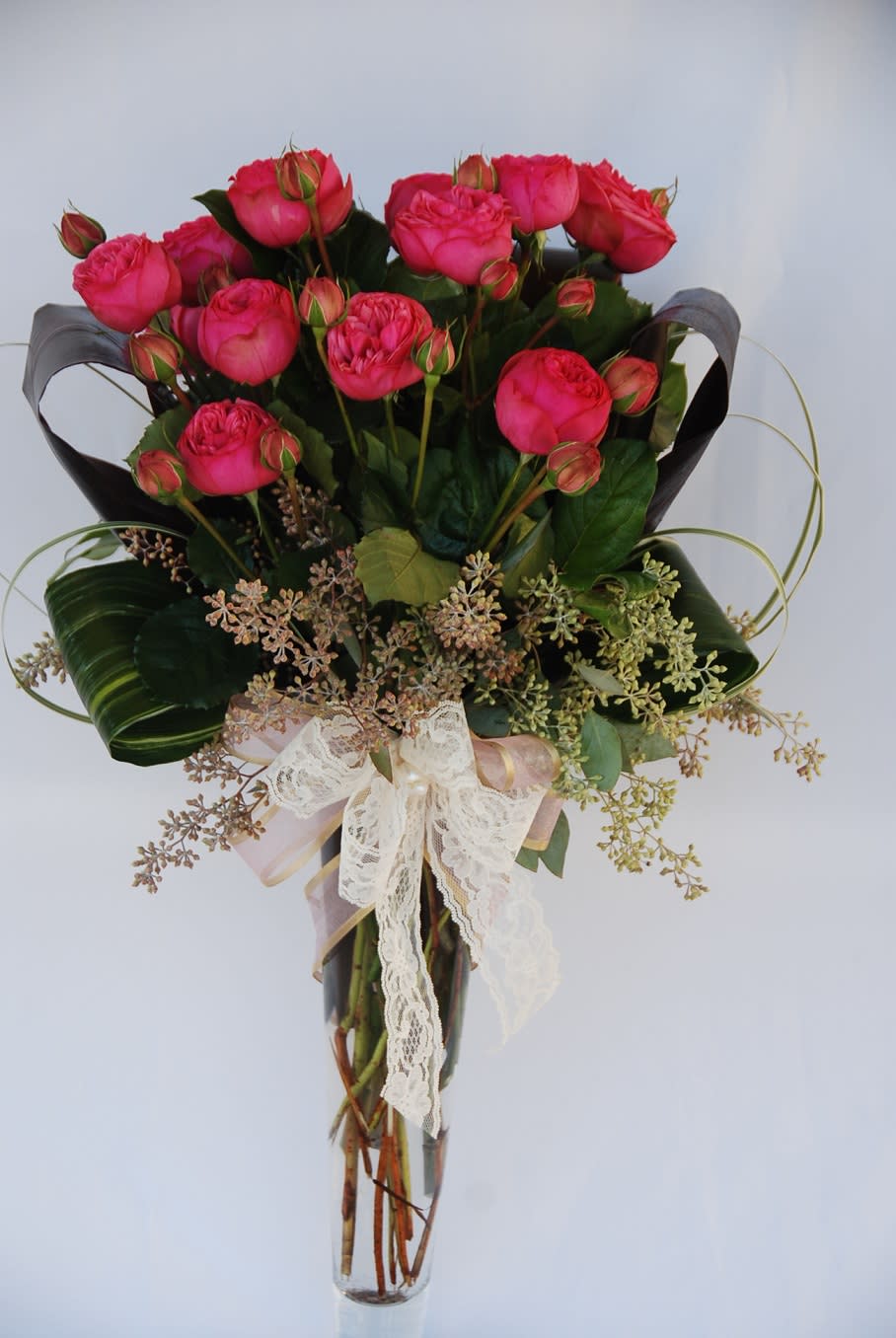 Chic Rosette - One dozen chic garden roses in tall glass vase with seeded eucalyptus and beautiful lace accent good for Anniversary, Valentin's Day, Birthday.