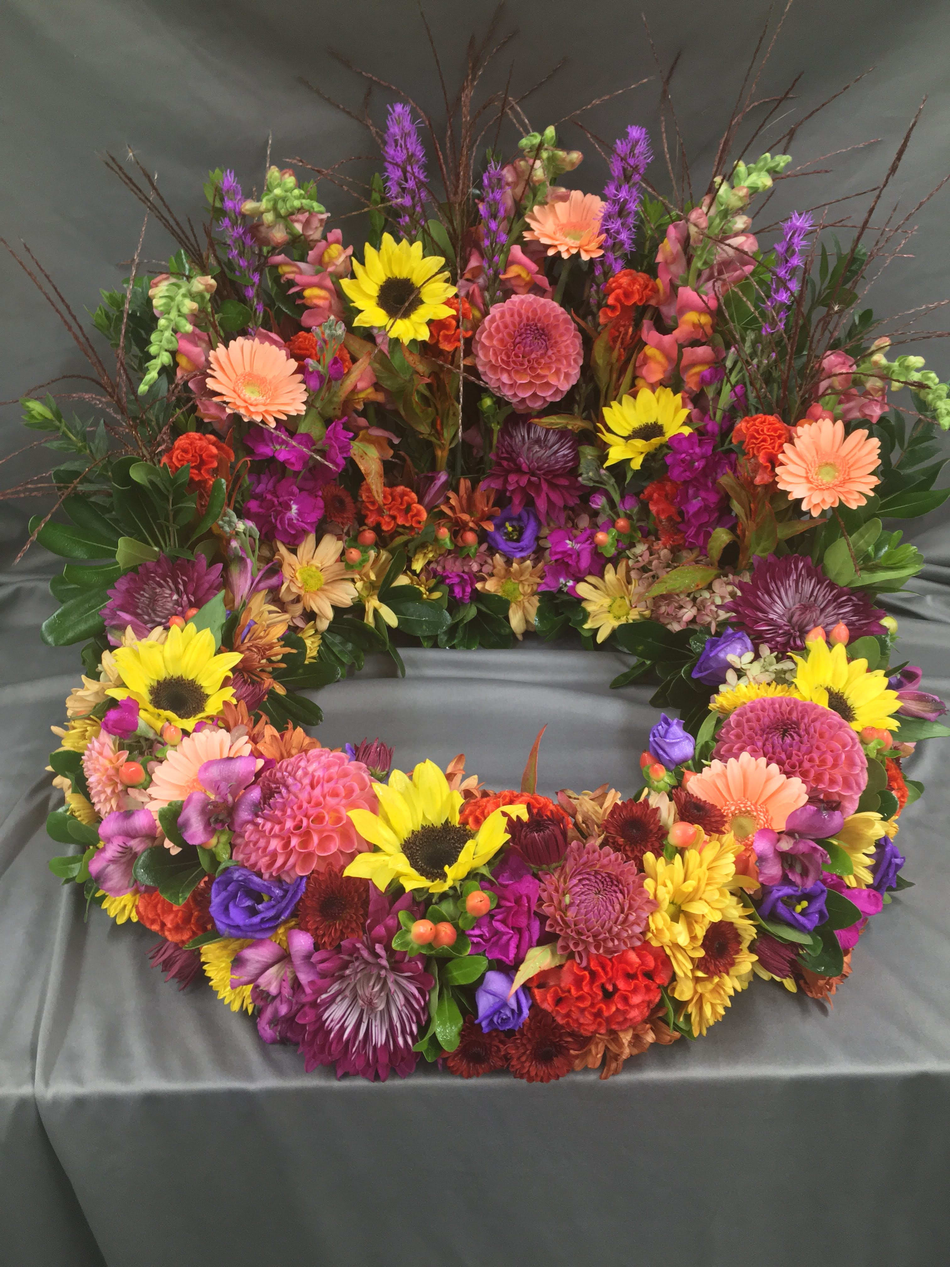 Eternal Beauty - A beautiful mixture of fall blooms in jewel tones.   *Picture Reflects Deluxe Pricing*