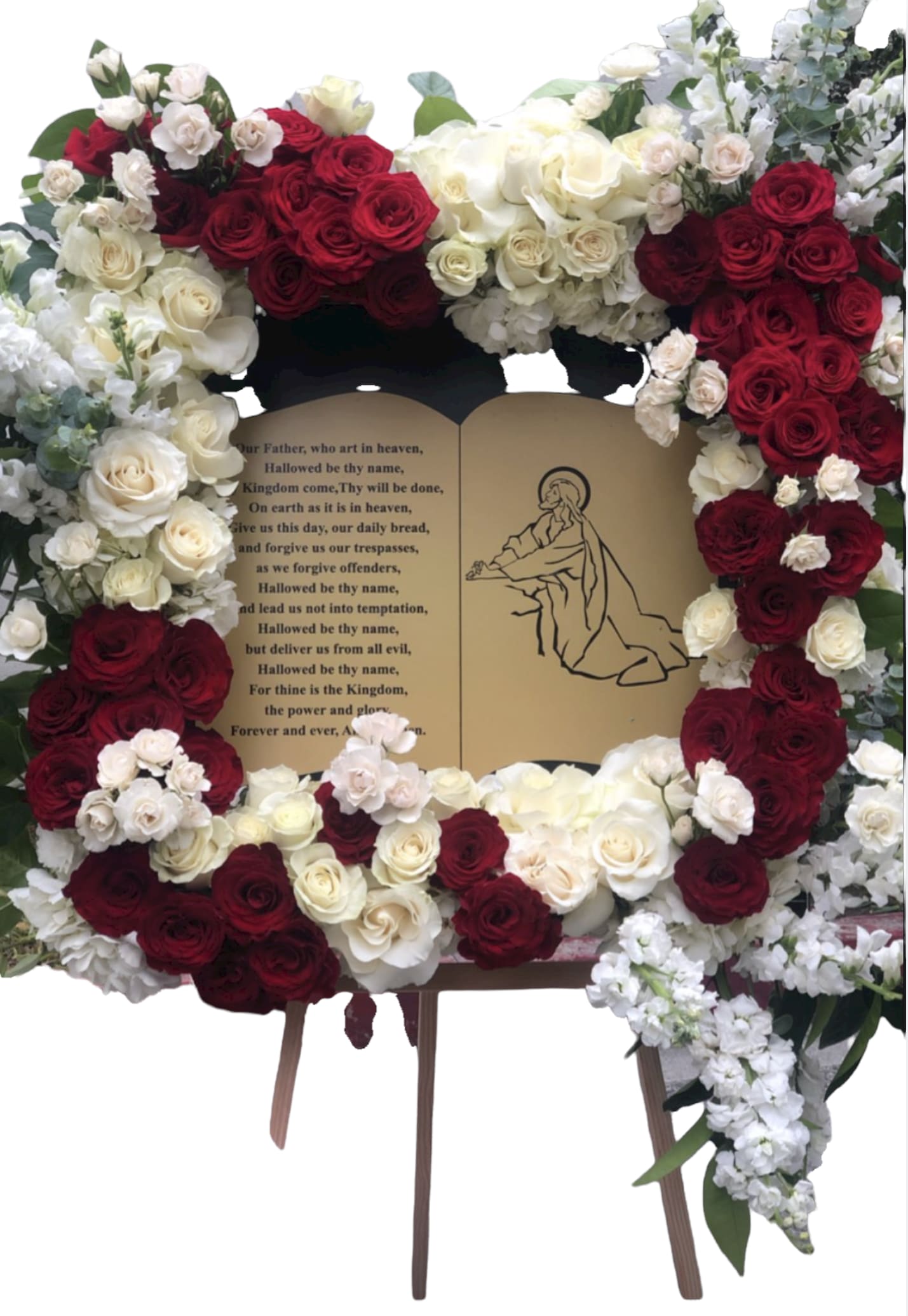 Heavens doors Heavens doors - This funeral piece has florals around a piece/quote of a bible quote. We do not provide the Bible quote. This arrangement has the following florals; Roses, spray roses, stock, hydrangea, and greenery.