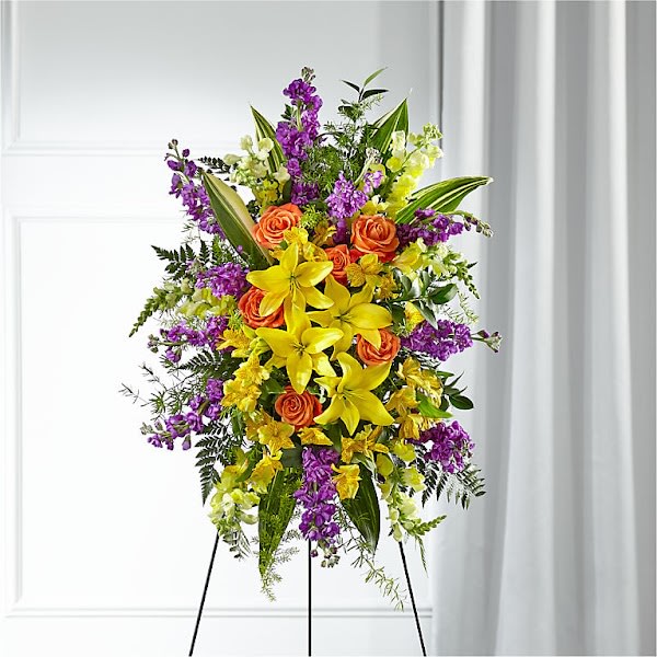 Thoughtful Prayers Standing Spray - Our Thoughtful Prayers Standing Spray beautifully remembers their passion and radiance within each bright bloom. Bold lilies, roses, stock and snapdragons are paired with lush greens to celebrate the life of a loved one. This grand standing spray is hand delivered by a local florist and is best suited to send to a service or funeral home.