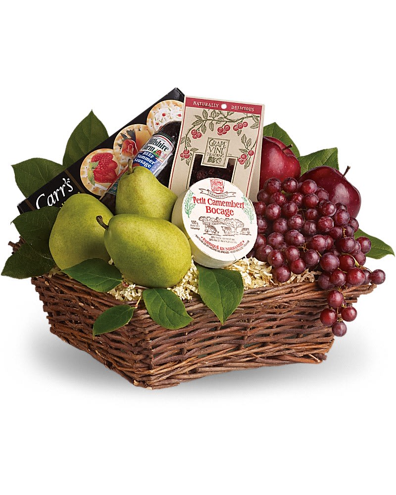 KF_T107-2A  Delicious Delights Basket - ***Minimum of 24 hours notice during business hours required prior to date of delivery or pickup. When choosing delivery, please provide the recipients phone number as we will not deliver until we confirm with the recipient that they will be home to receive their order. Orders will not be left at the door under any circumstance.***  It's delicious. It's delightful. It's a foody dream come true. Full of fruit fun and more this is a perfect gift for any occasion. Red apples and grapes pears yummy dried cranberries cheese summer sausage and crackers are all wrapped up in a wicker basket and ready to be enjoyed. Deliciously different!