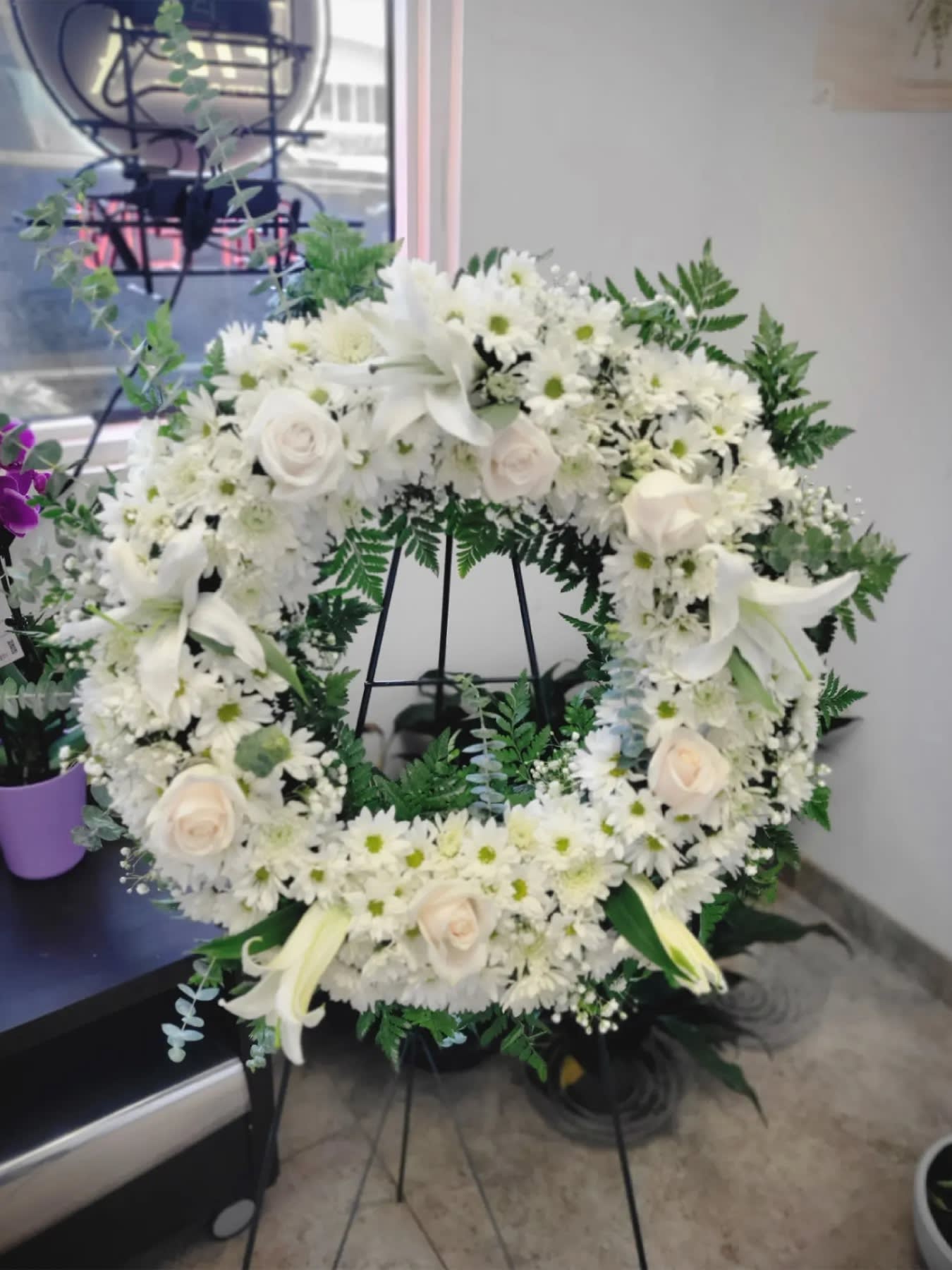 peace and love tribute wreath - A beautiful white and green tribute wreath that calms, this easel arrangement celebrates a full life and a peaceful passing.  Flowers and similar colors