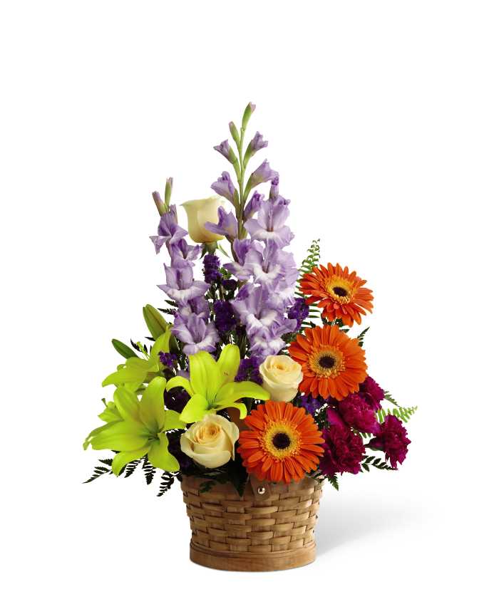 The FTD Forever Dear Arrangement - The FTD Forever Dear Arrangement is a colorful assortment of our finest blooms. CrÃ¨me de la CrÃ¨me roses, yellow Asiatic lilies, orange gerbera daisies, lavender gladiolus, plum carnations, and purple statice are accented with leatherleaf and sword fern stems. Gorgeously displayed in a natural buff woodchip basket, this arrangement will add to the natural beauty and serenity of their final tribute.