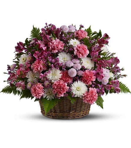 Garden Basket Blooms [TFWEB559] - Sometimes, a simple basket of blossoms is all that's needed to show how much you care. This bright bouquet will be a sincere symbol of your warm thoughts and affection. Fresh blooms are hand-arranged, then hand-delivered in a woven basket.  A mix of fresh pink, lavender and white flowers such as carnations, button and cushion spray chrysanthemums, carnations and waxflower – accented with ferns – is delivered in a woven basket.   Approximately 22&quot; (W) x 17&quot; (H)  As Shown : TFWEB559