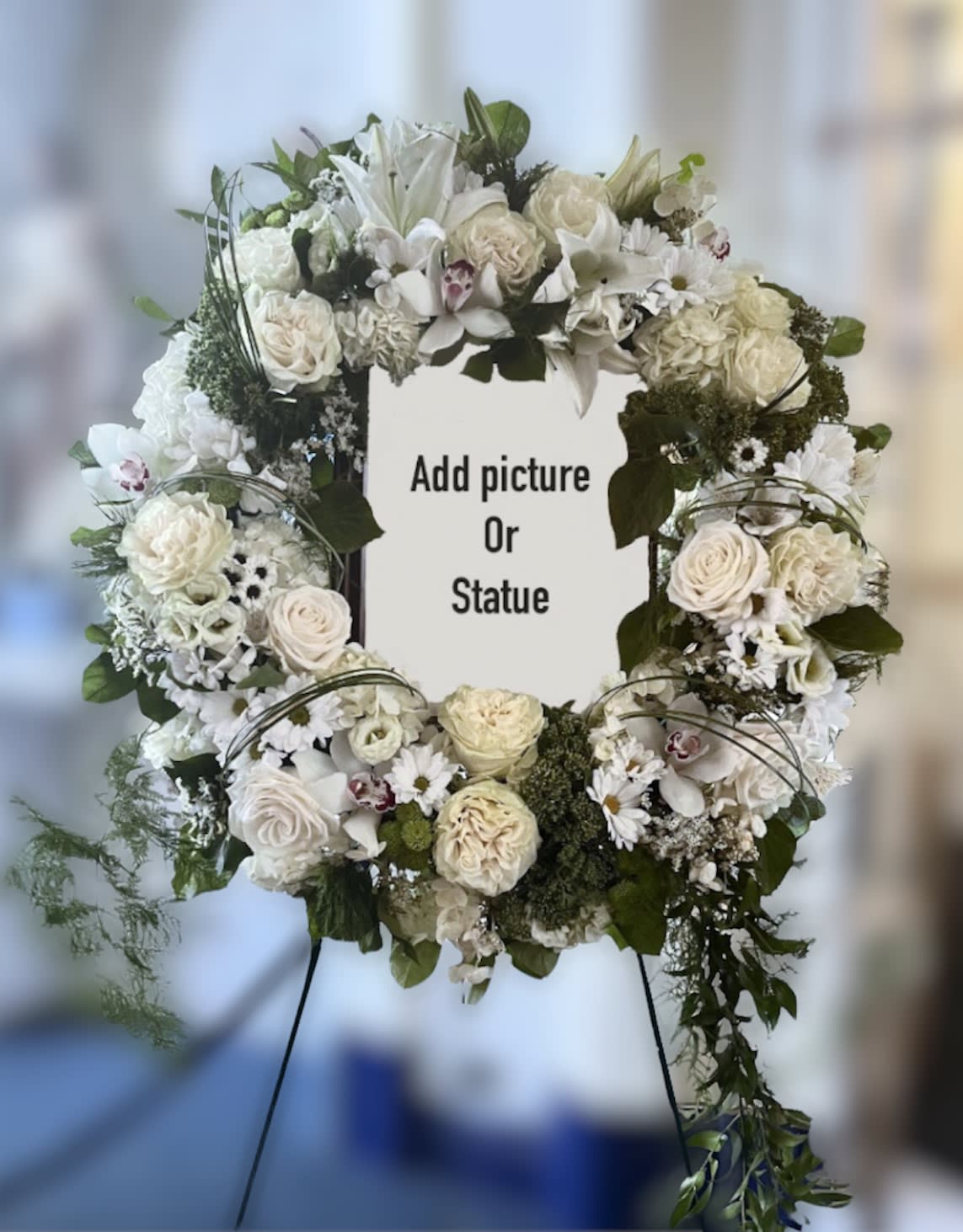 Loving memories wreath  - An elegant white wreath with different flowers to be used with a picture frame or statue. 