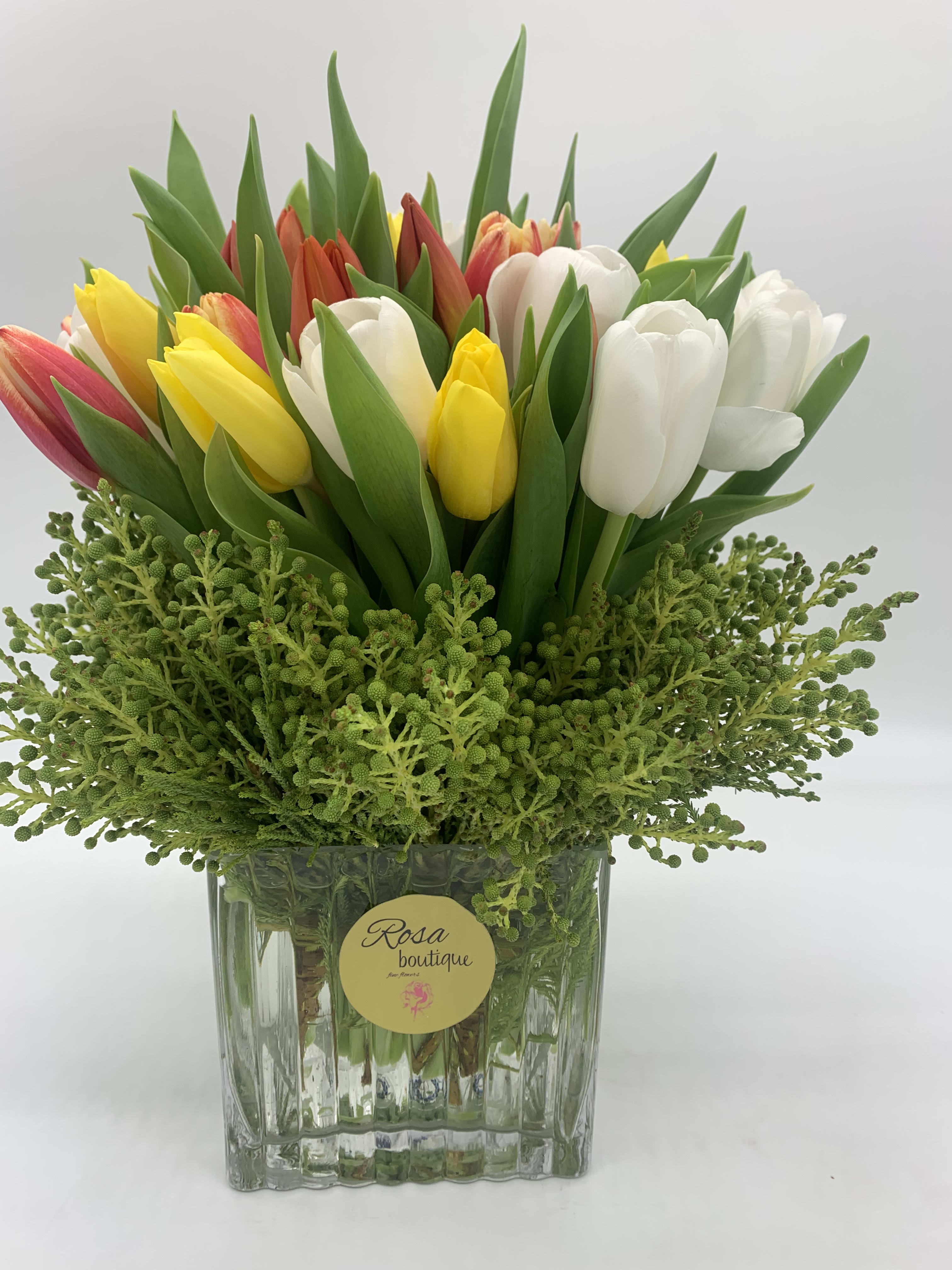 Divine  - Forty mixed colors for special occasion or everyday. It is sitting in a square glass vase 5x5 tall 10”Make someone feel special.