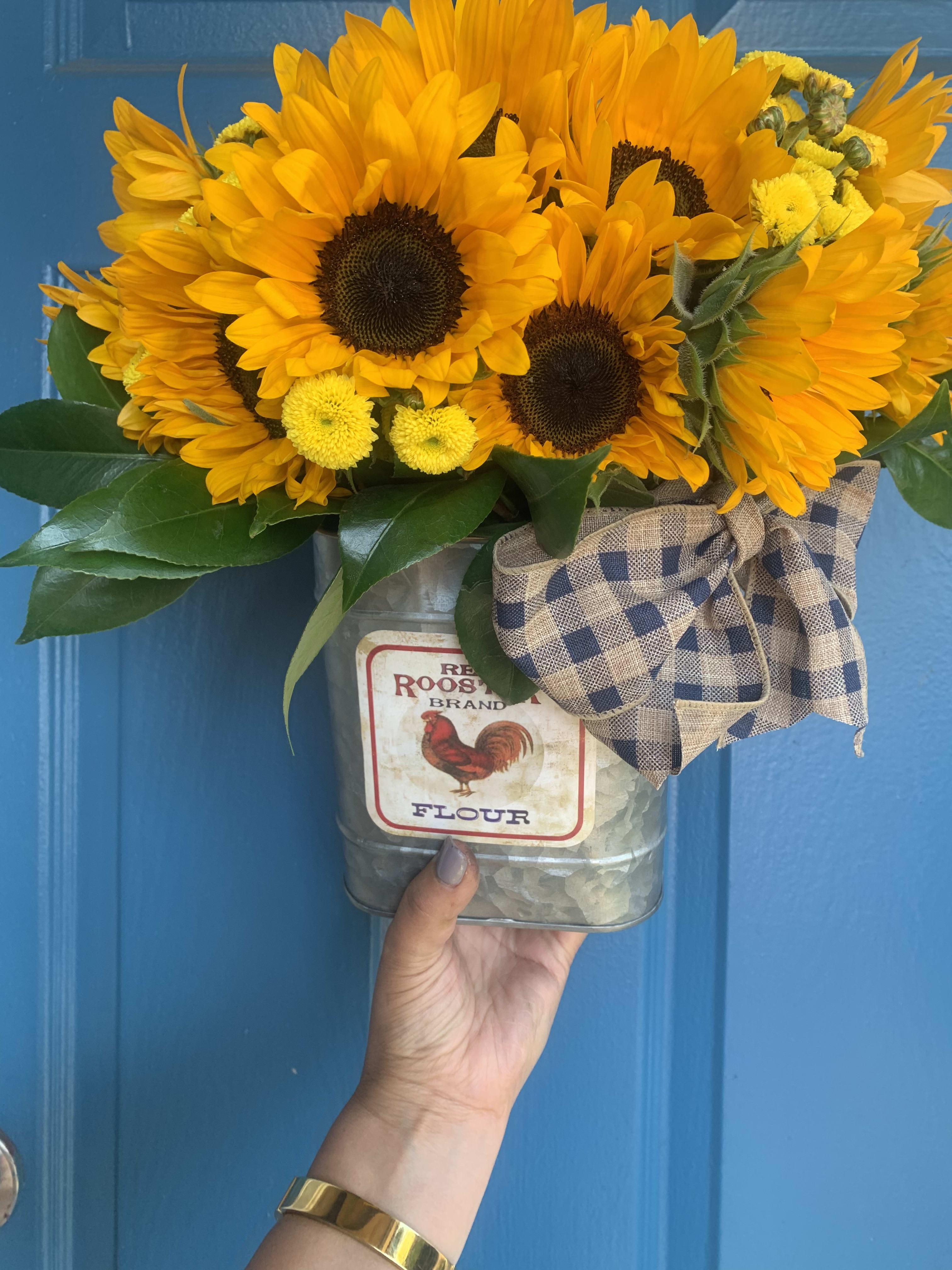 Sunshine i - This bright arrangement is made of the portion of 18 sunflower sitting in tin vase reusable for your home decoration  is 4”w 5”H buy now make some one happy.