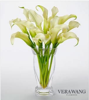 Vera Wang White Calla Lily Bouquet - Picked fresh from the farm to exude a classic beauty and grace, the Vera Wang White Calla Lily Bouquet is set to impress. Hand gathered at select floral farms, this stunning flower arrangement simply showcases the clean white lines that come only from the calla lily bloom. Boasting 15 stems of these coveted flowers, this stunning bouquet has been picked fresh for you to assist you in turning the ordinary into extraordinary with its divine elegance. Presented with a superior clear glass vase. Approximately 15-inches in height. Your purchase includes a complimentary personalized gift message.