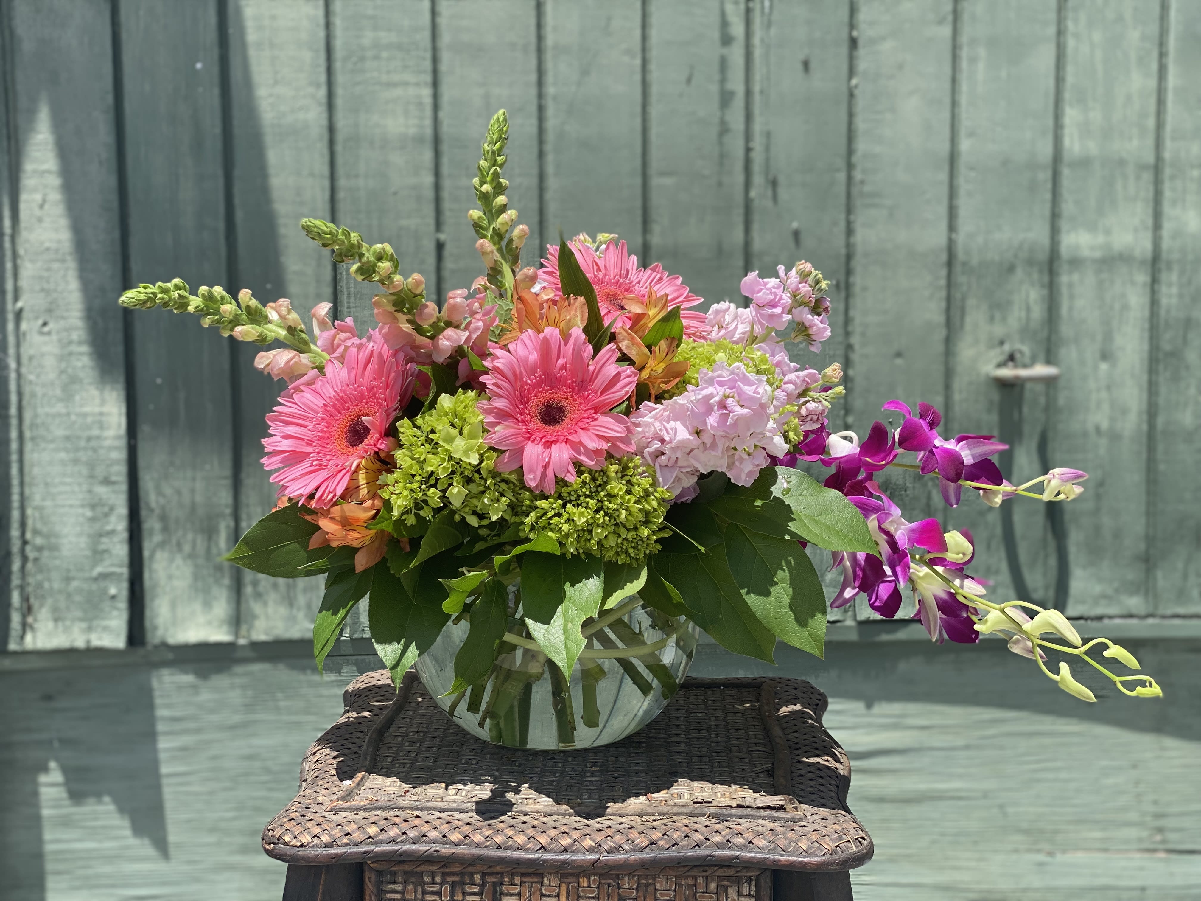 Bursting Beauty - Bowl full of fresh spring flowers, hydrangea, orchids, gerbera daisies and more.