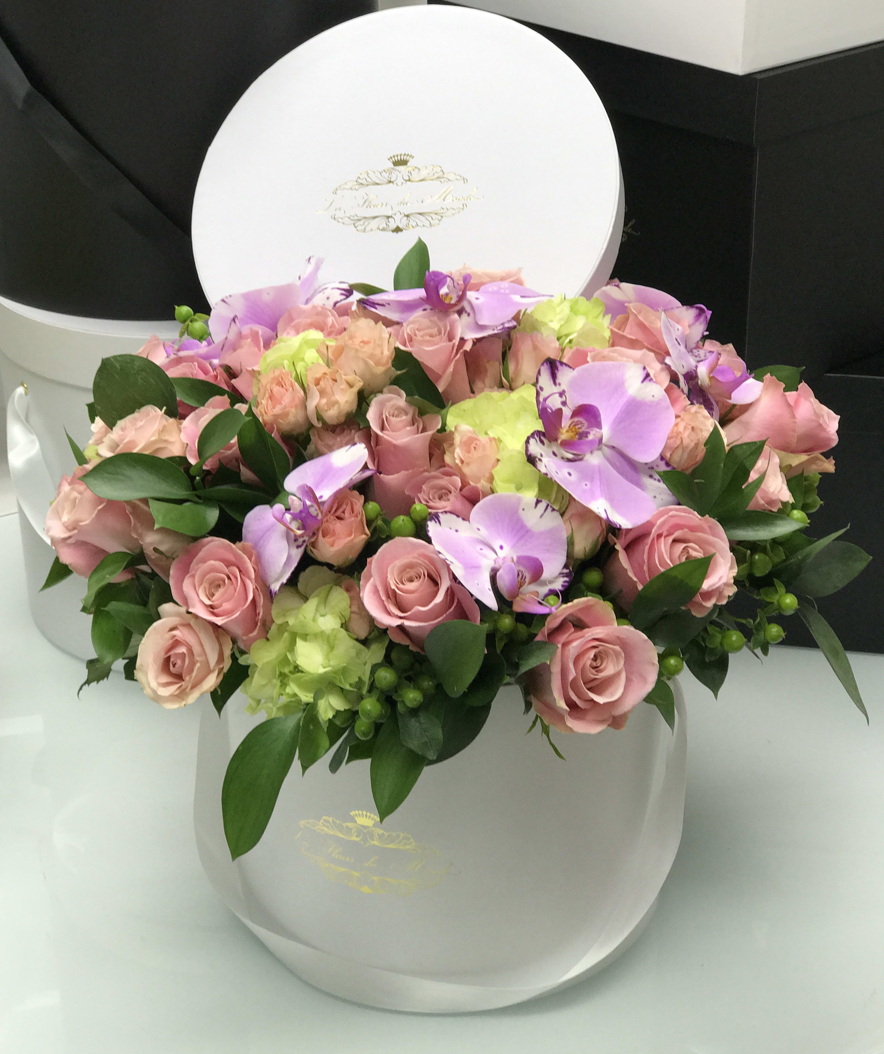 Call it Spring! - This gorgeous display of soft toned flowers is sure to brighten up the room they are in and the special someone they are for!