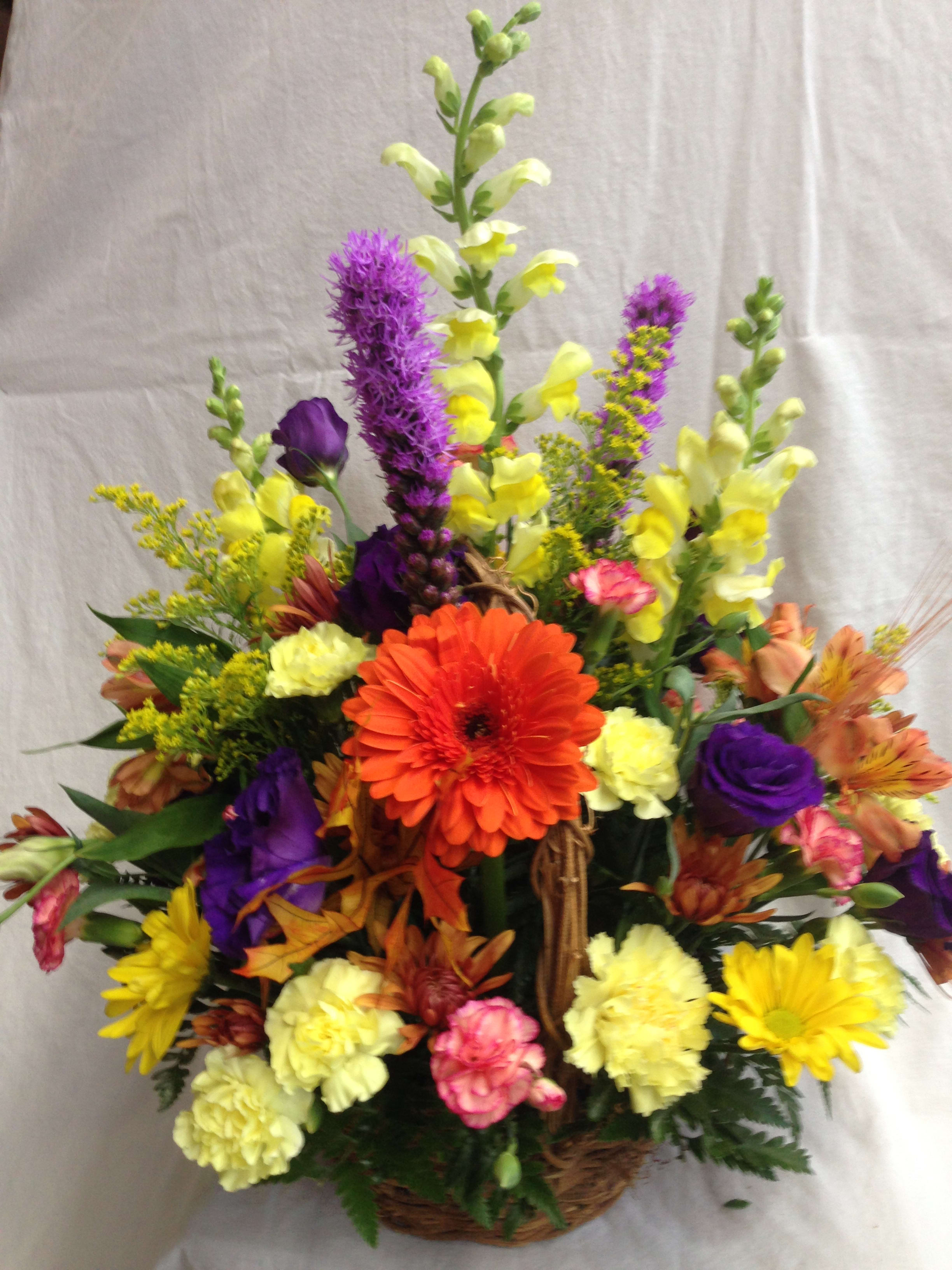 Fall basket  - A Rustic basket with festive fall flowers of snapdragons, alstroemerias, lizianthus and fall mums