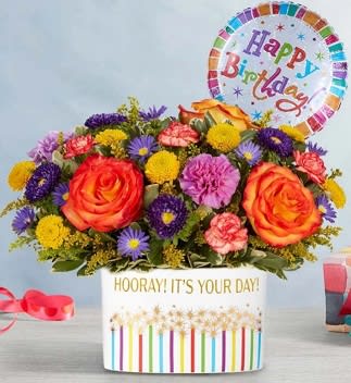 Birthday Hooray - Celebrate the special days, big and small, with our medley of bright blooms. Festively arranged in our keepsake “Hooray It’s Your Day” container, this happy surprise is sure to make the moment one they’ll remember. Arrangement contains 1 mylar birthday balloon 