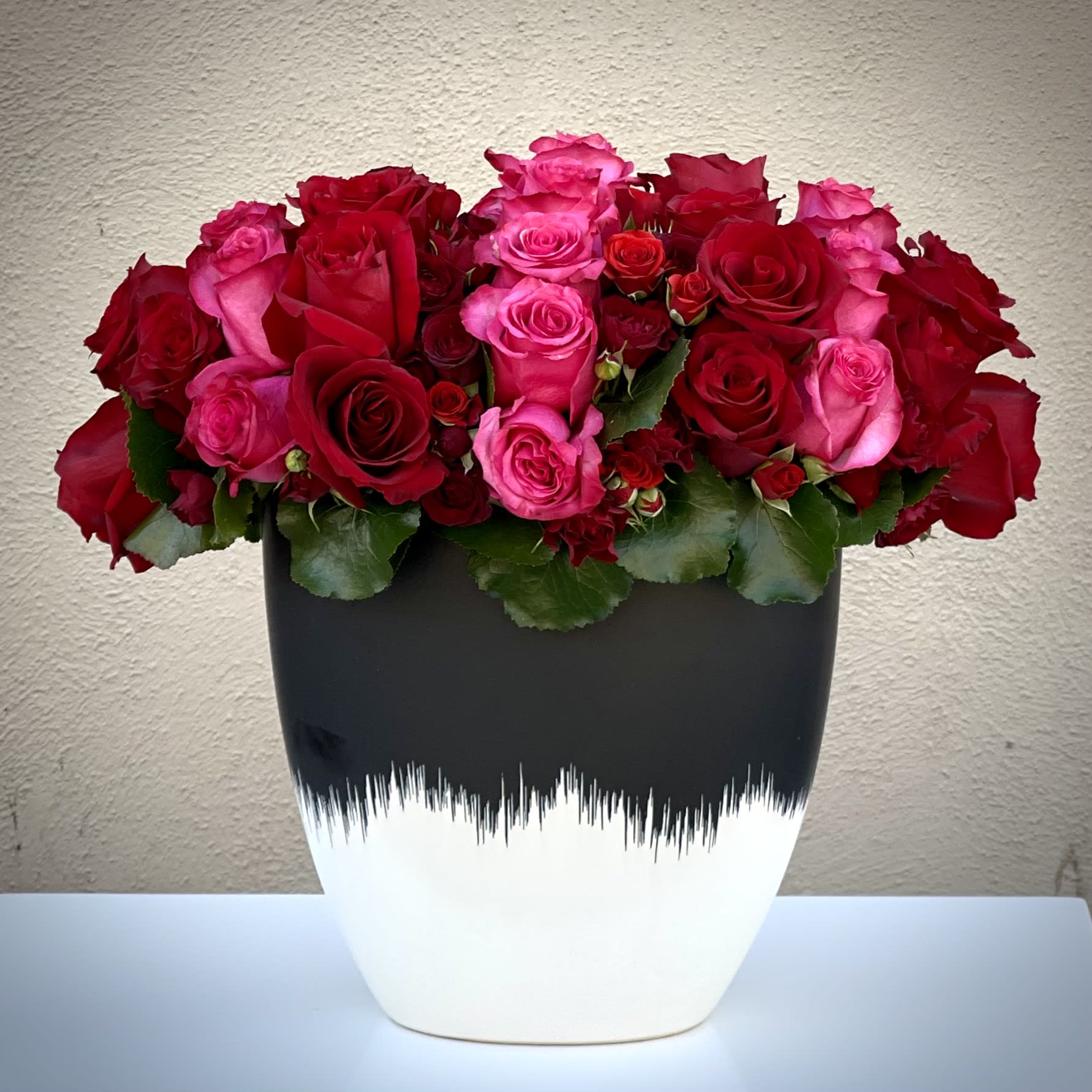 Red and Pink Parade Red and Pink Parade - You can never go wrong with an arrangement. Let our florist design this timeless 50 red and pink bouquet to make a statement for your special someone. Red and pink Roses are an elegant, iconic and romantic gift for anyone close to your heart.