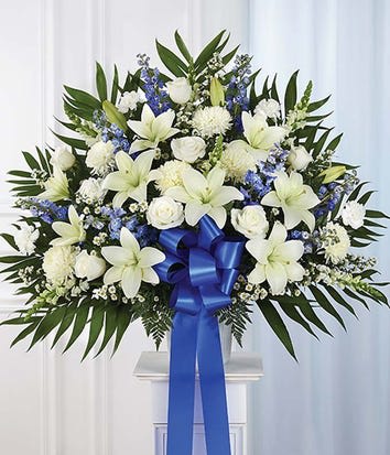 Blue & white sympathy Arrangement Blue & white sympathy Arrangement - White Roses and blue delphiniums