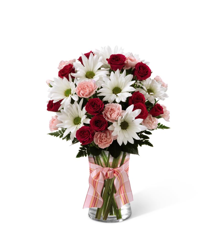 FTD Sweet Surprise Bouquet - The FTD Sweet Surprises Bouquet is an absolutely charming way to send  your warmest sentiments. Deep fuchsia and pink mini carnations, pink  roses, white traditional daisies and lush greens are sweetly situated in  a classic clear glass vase accented with a perfectly pink designer  ribbon to create a bouquet that will delight your special recipient at  every turn (good version does not include roses). GOOD bouquet is  approx. 15H x 12W. BETTER bouquet is approx. 16H x 13W. BEST bouquet  is approx. 16âH x 13âW. EXQUISITE bouquet is approx. 19H x 16W. 