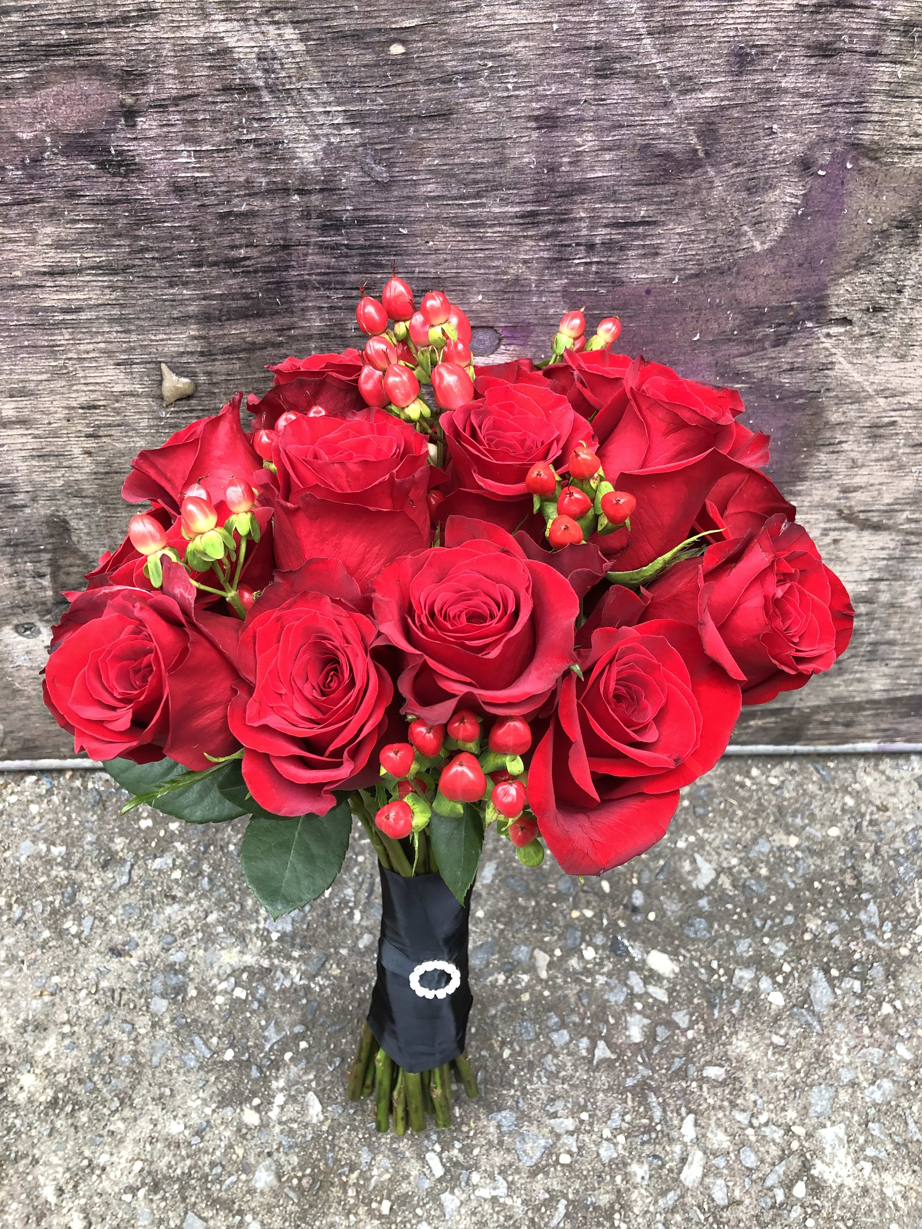 The Red Charm Bouquet The Red Charm Bouquet - You know you want The Red Charm Bouquet. With its classic purity and romantic love of red roses, this beautiful arrangement radiates purity, passion, and flexibility to suit every bride’s style. A classic bouquet of red roses brings elegance and romance to any wedding or anniversary. The perfect addition to an ornate comb, this beauty is sure to delight!