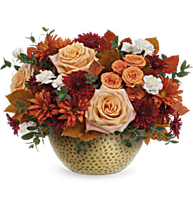 Teleflora's Artisanal Gold Bouquet - This Artisanal Gold Bouquet goes for the gold of fall flowers. This autumn bouquet is filled with lush roses and displayed in a hammered metal gold keepsake bowl that's sure to become a year-round décor favorite.