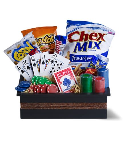 Poker Night Poker Night - A classic poker night is an entertaining "guys' night" spent with friends. And this fun basket - filled with cards poker chips and a selection of sweet and savory treats - has everything a poker lover might need. A great all-occasion gift. A wooden box is filled with a deck of playing cards 3 packs of poker chips and an assortment of gourmet treats such as Chex Mix Cheetos Corn Nuts peanuts and a candy bar. Approximately 11" (W) x 3.5" (H) Please note: All of our bouquets and gift baskets are hand-arranged and delivered locally by professional florists. This item may require additional lead time so same-day delivery is not available. Orientation: One-Sided As Shown : TFWEB376 Available for local delivery only
