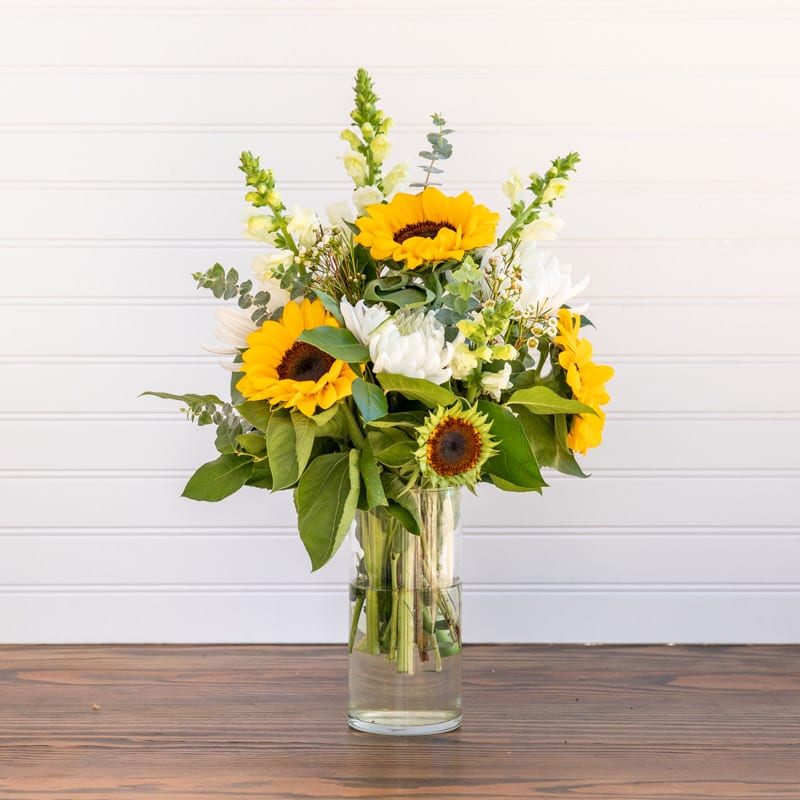 You are my Sunshine - Sunflowers just make life better! They have a way of mimicking the sun, and brightening even the gloomiest day! A light and lovely mixture of yellows and whites are sure to bring the smiles :)