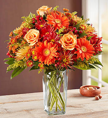 Majestic Fall Bouquet Majestic Fall Bouquet - Capture autumn’s majestic landscape with the Majestic Fall Bouquet features orange long-stem roses and Gerbera daisies, red hypericum, yellow solidago, bronze cremone, micro poms, cushion poms and daisy poms; accented with fresh greenergy.