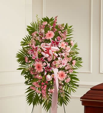 Deepest Sympathies Standing Spray - Pink - Product ID: 91288   This Sympathy Standing Spray, in shades of pink, is a beautiful symbol of your sympathy and support. Pink flowers such as roses, stargazer lilies, larkspur, snapdragons and more An appropriate gift for family, friends and business associates to send directly to the funeral home Our florists use only the freshest flowers available so colors and varieties may vary Large measures approximately 56&quot;H x 40&quot;L without easel Medium measures approximately 46&quot;H x 38&quot;L without easel Small measures approximately 42&quot;H x 32&quot;L without easel