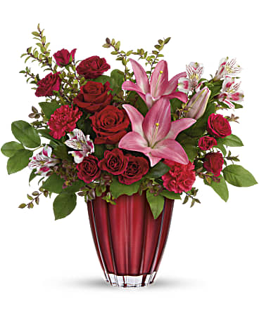 Romantic Radiance - Shimmering with a metallic ombre finish and bursting with a lavish bouquet of classic red roses and pink lilies, this unique European glass vase is a Valentine's Day gift they'll cherish forever.