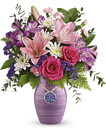 My Darling Dragonfly - Complete with an artful dragonfly pendant and a gorgeous purple glaze, this artisanal ceramic vase is a gift all on its own! Bursting with roses and lilies.