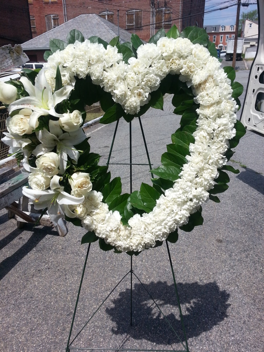 Pure Heart - A heart covered in white flowers to convey your pure feelings to your loved one. Heart includes roses and lilies.