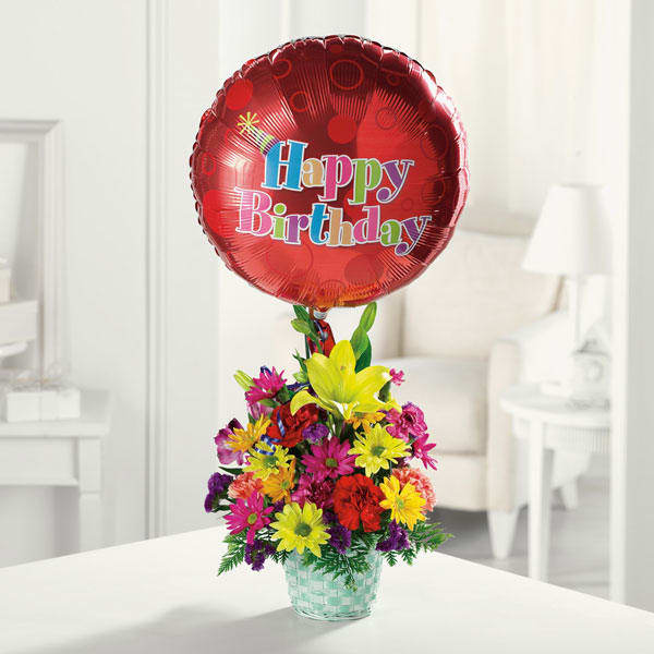 Happy Birthday Basket - A basket brimming with our freshest daisy pompons, alstroemeria, an Asiatic lily and carnations, topped with a birthday balloon. The best gift for every age!