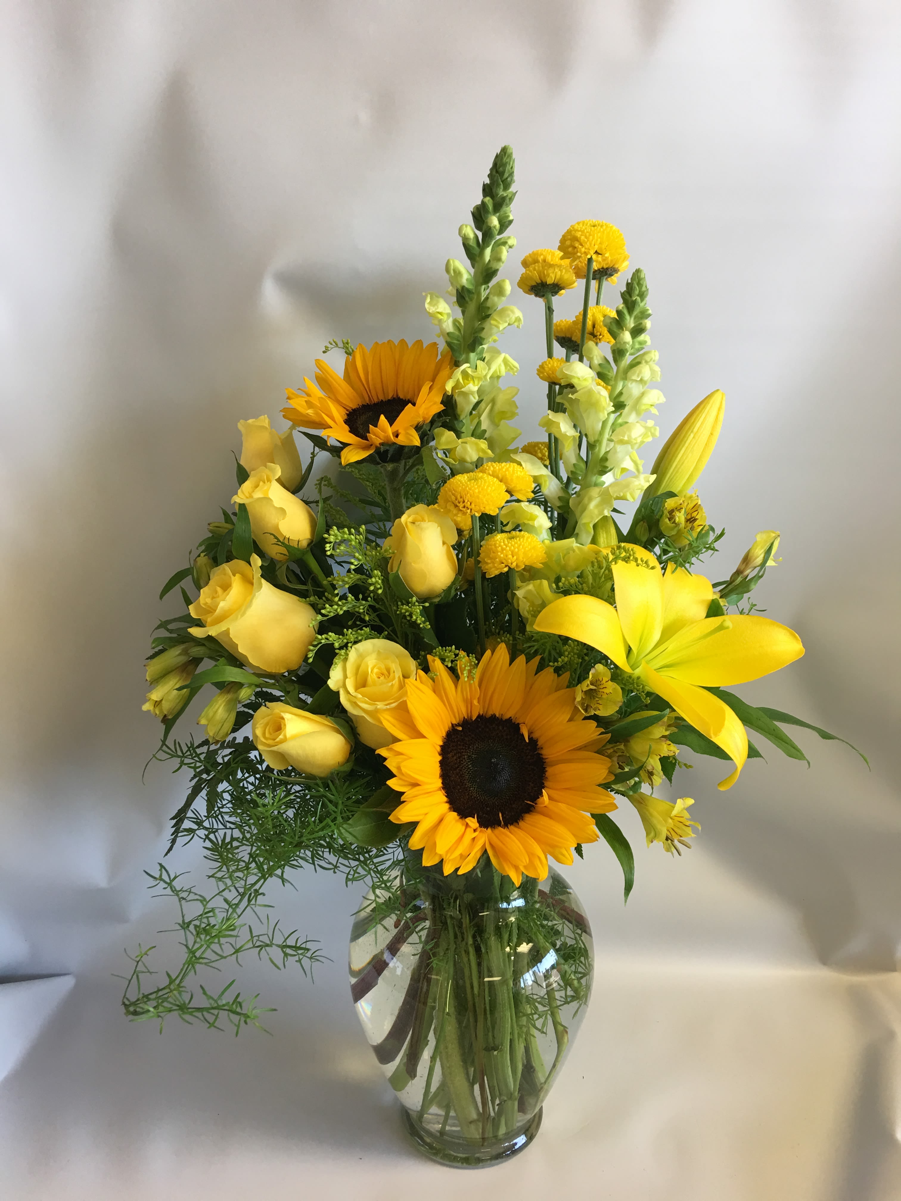 Heart Of Gold - Mixed of sunflowers, lilies, roses, snapdragon and yellow flowers. 