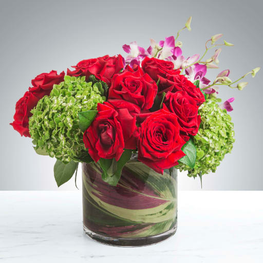 Bejeweled Nights by BloomNation™ Bejeweled Nights by BloomNation™ - A celebration of luxury and life, this large and jewel toned arrangement is enough to stop anybody in their tracks. Roses, orchids and hydrangeas come together in this purely floral masterpiece. APPROXIMATE DIMENSIONS are 12"D X 12"H