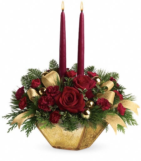 Teleflora's Crimson and Gold Centerpiece Teleflora's Crimson and Gold Centerpiece - This lovely centerpiece will melt hearts. Roses and carnations are elegantly arranged in our handsome Harvest Gold bowl.