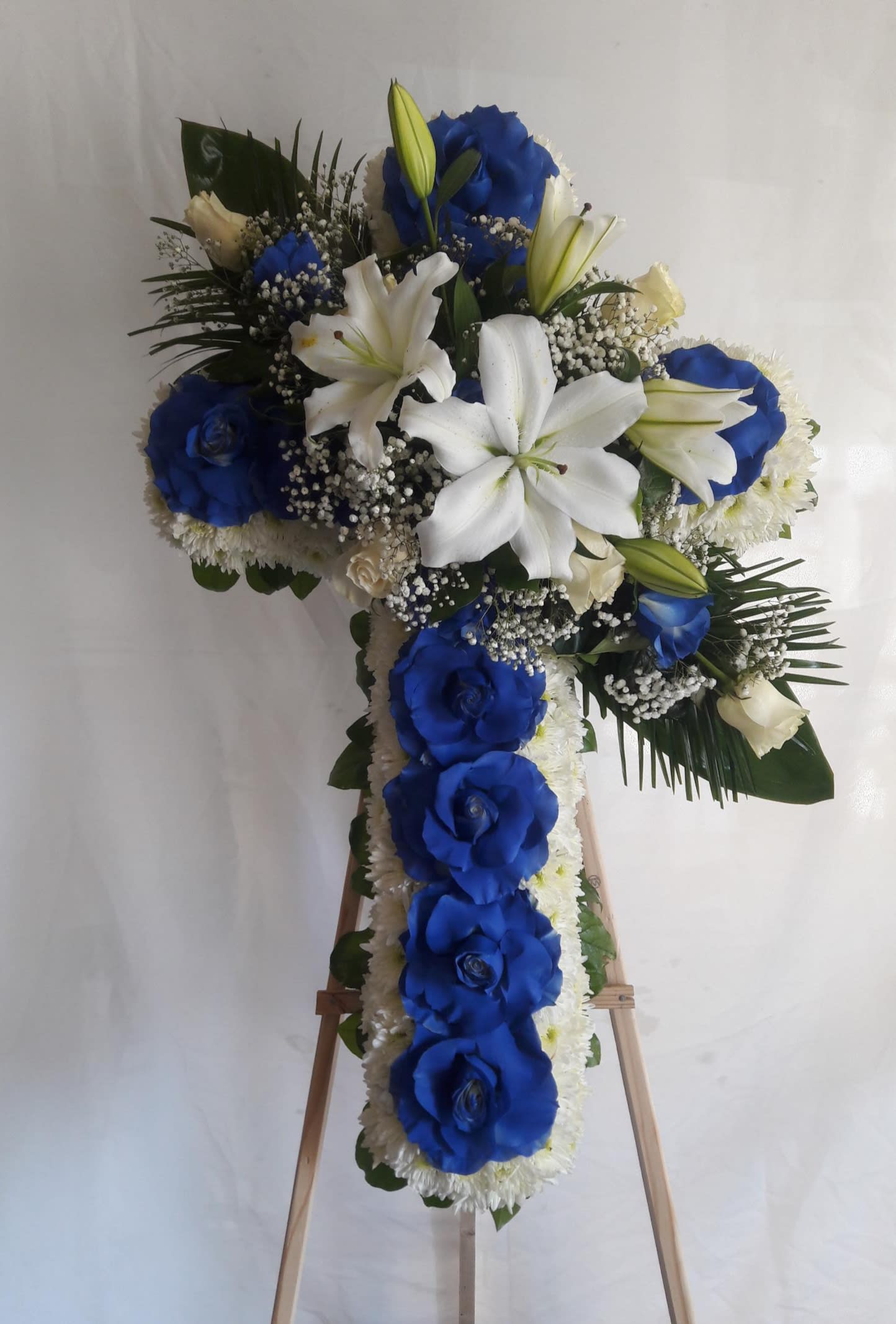 Blue &amp; white  standing Cross  - This Beautiful Sympathy Rose is wonderful floral tribute 