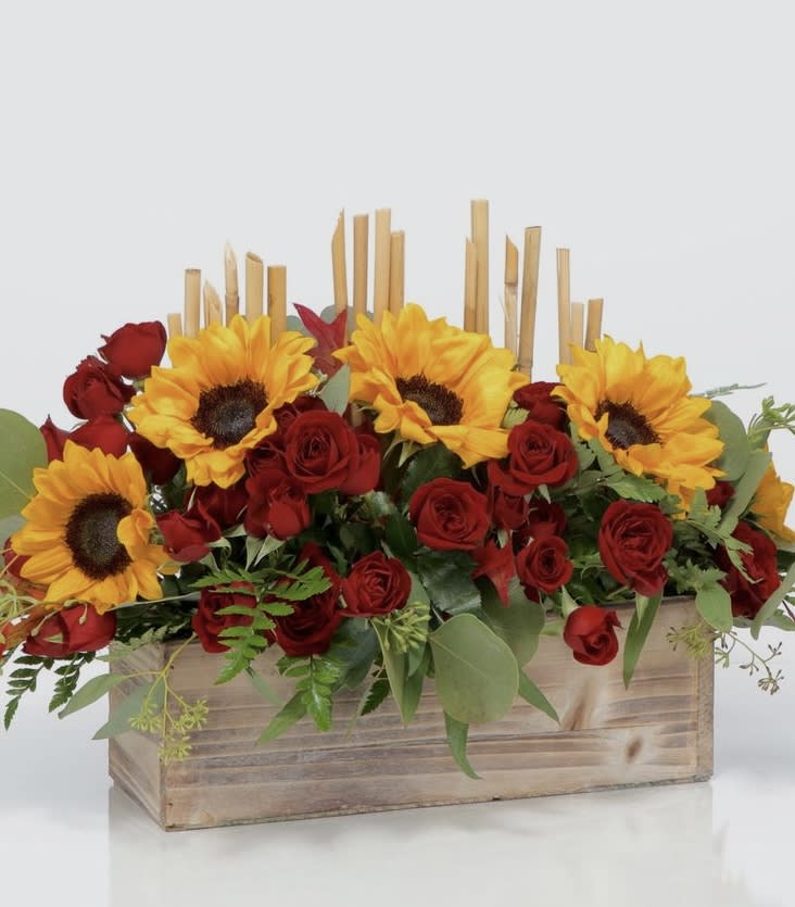 FAITHFUL FALL - It's the season for sunflowers, and this arrangement does not disappoint! Send sunny flowers to brighten their day and show them how appreciated they are. 