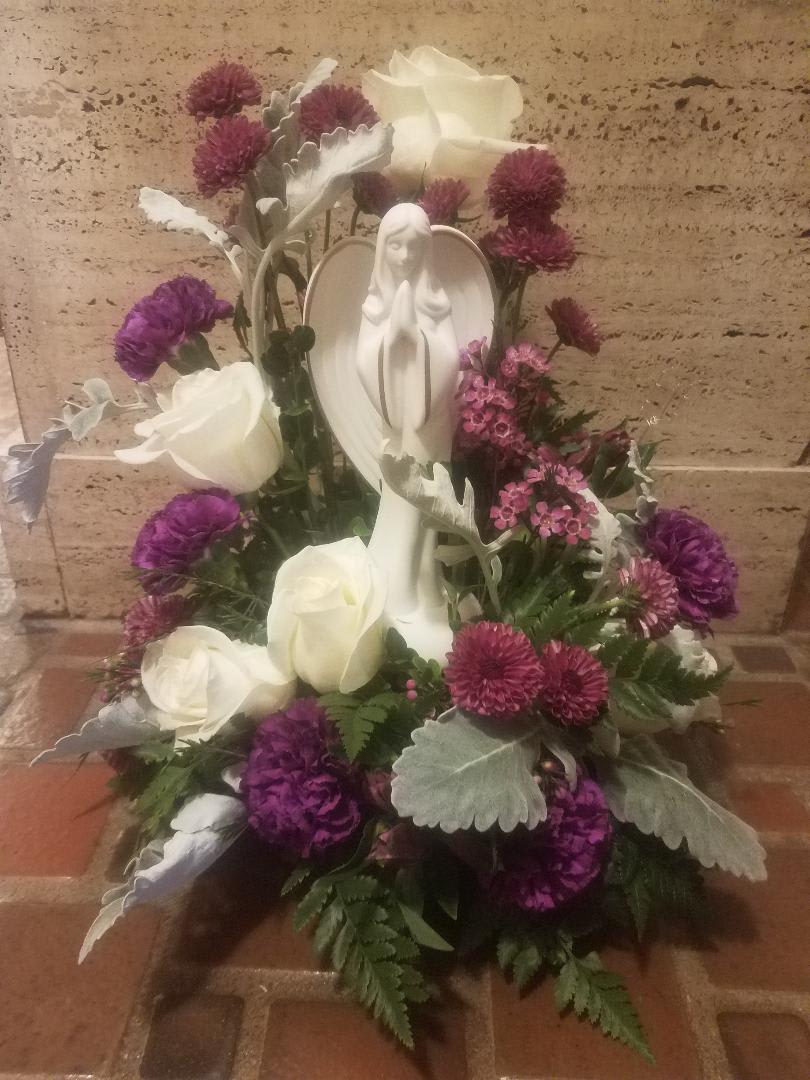 An Angels's Garden - Purple and white flowers surrounding this keepsake angel (8 3/4&quot; tall) that they will always have to remember your thoughtful gesture at this difficult time in their life.