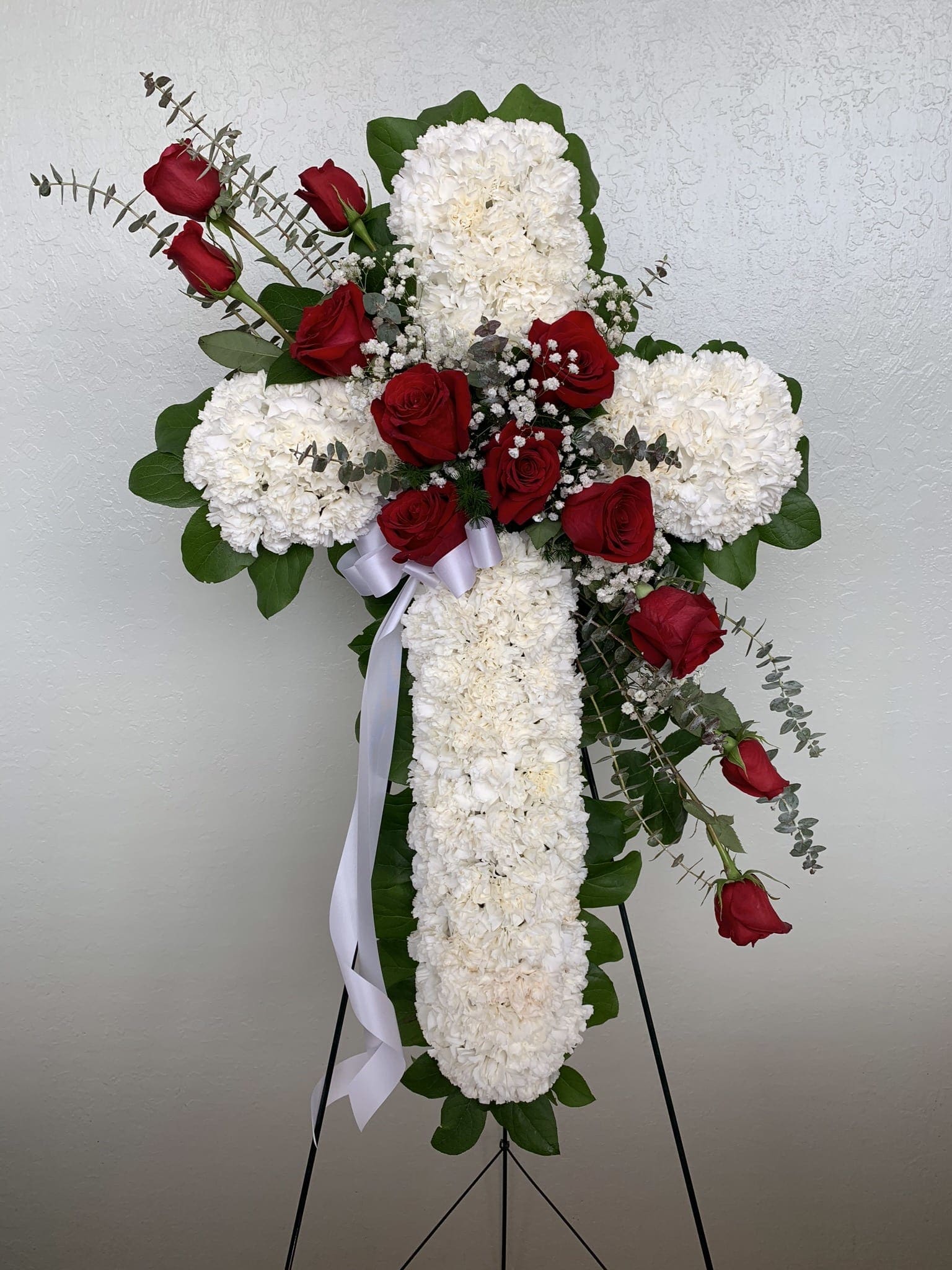 CR#01 Eternal Grace Cross  - White Carnations Cross with Elegant Red Roses, baby's breath, and greens.   Standard: Cross 34&quot; H Premium: Cross 40&quot; H 