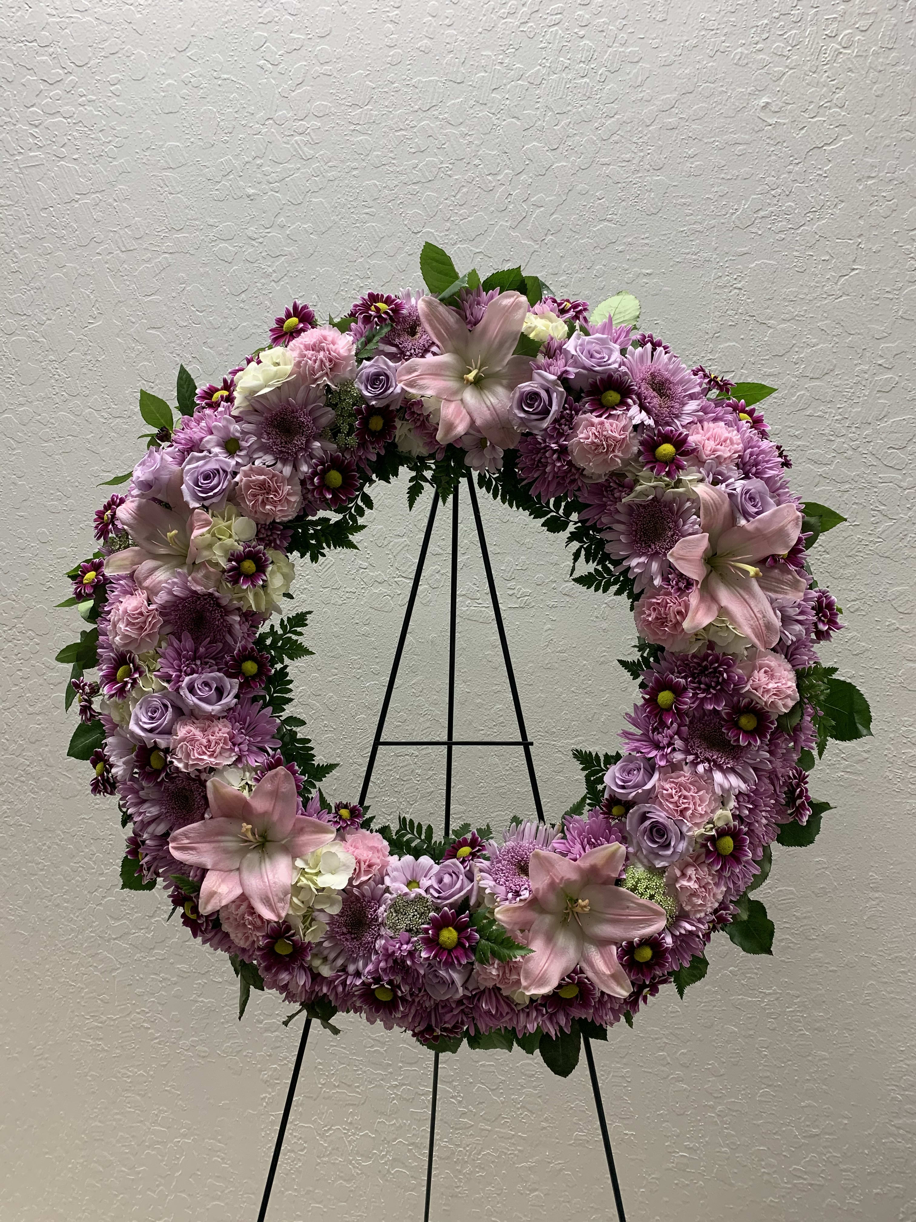 SW#04 Purple Serenity Wreath - This beautiful wreath stands as a testament to the circle of life that must be acknowledged even in our saddest moments. It will surely be appreciated by all in attendance.  Standard: 22&quot; diameter Deluxe: 26&quot; diameter (as shown) Premium: 30&quot; diameter
