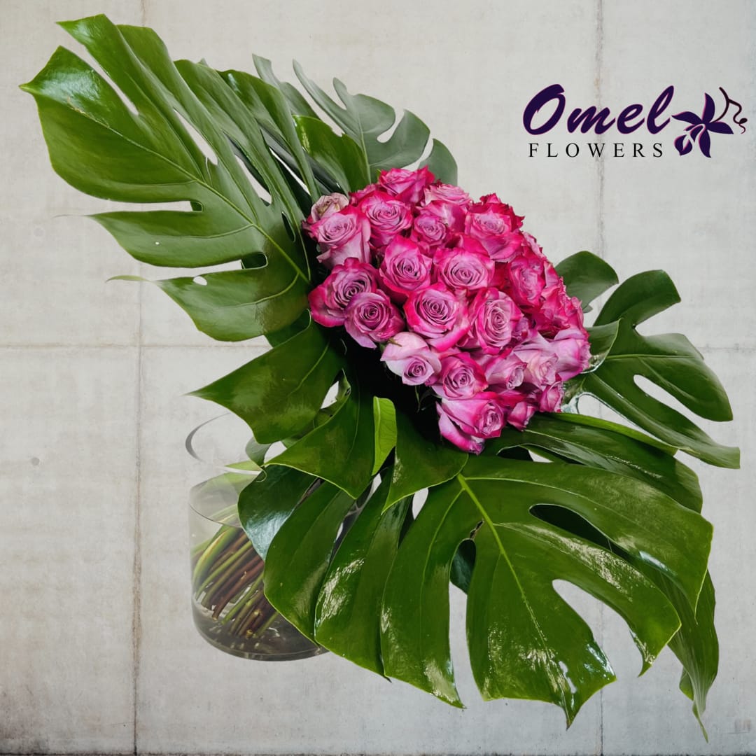 Purple Delight - Purple roses designed in a modern style with monstera leave and aspidistra tilted to the side is the perfect combination to show how much you love them
