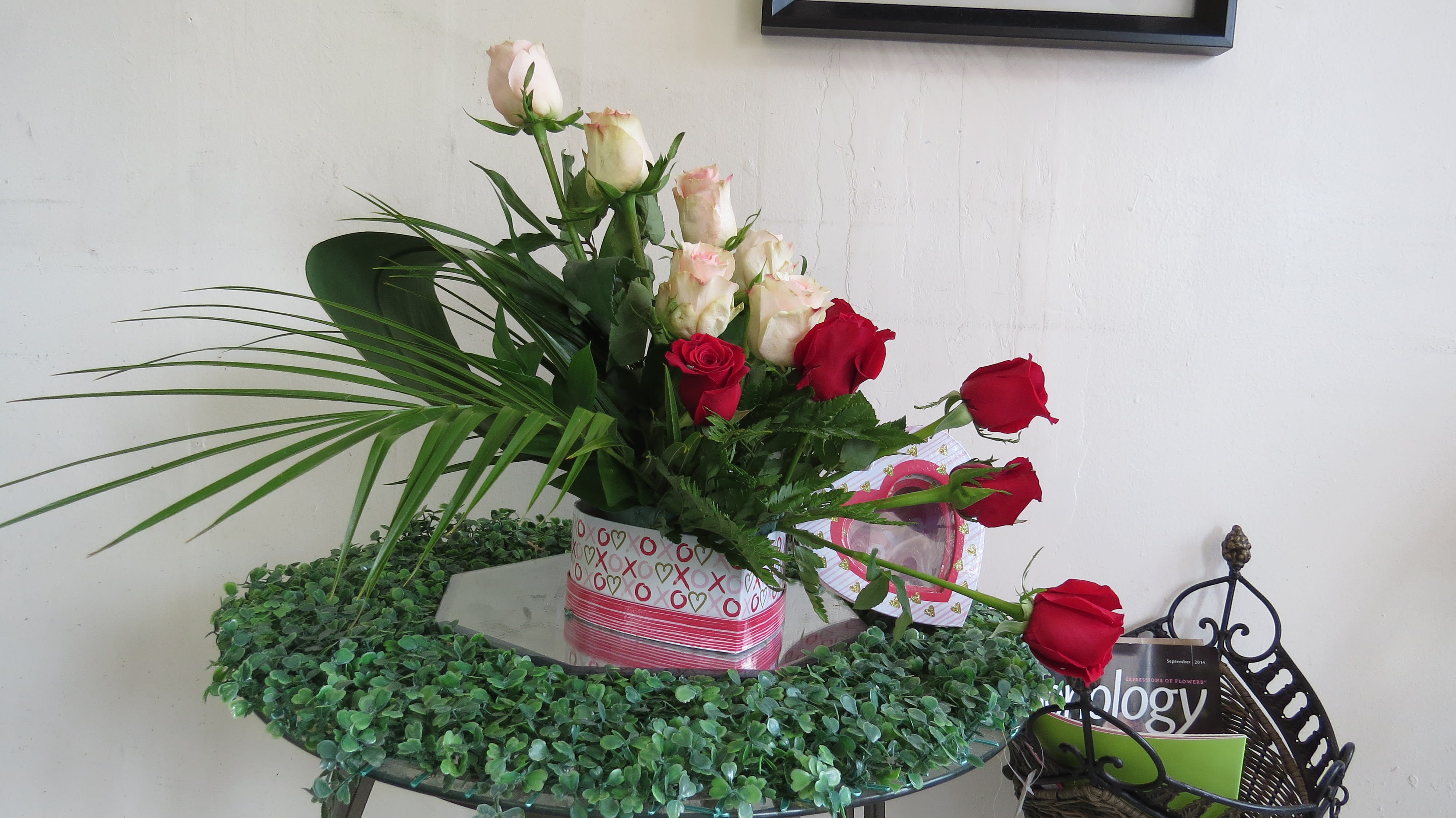 Love Box Love Box - Beautiful arrangement in a heart shape box with two different colors of roses and greenery.