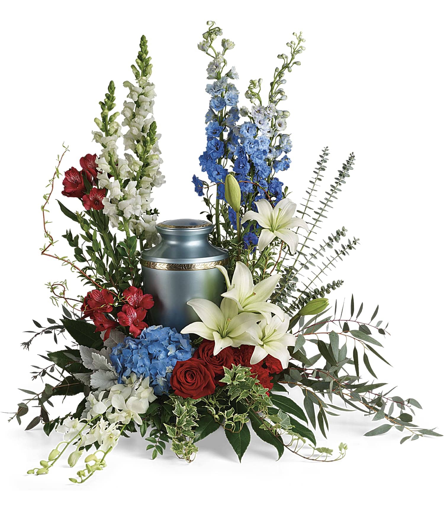 Reflections Of Honor Cremation Tribute - Proud and patriotic, this boldly designed red, white and blue bouquet displays the cremation urn with honor. This patriotic tribute includes blue hydrangea, white dendrobium orchids, red roses, white asiatic lilies, red alstroemeria, red carnations, blue delphinium, white snapdragons, dusty miller, myrtle, huckleberry, variegated ivy, curly willow, aralia leaves, parvifolia eucalyptus, spiral eucalyptus, and lemon leaf. Arrangement does not include urn.  T281-8A