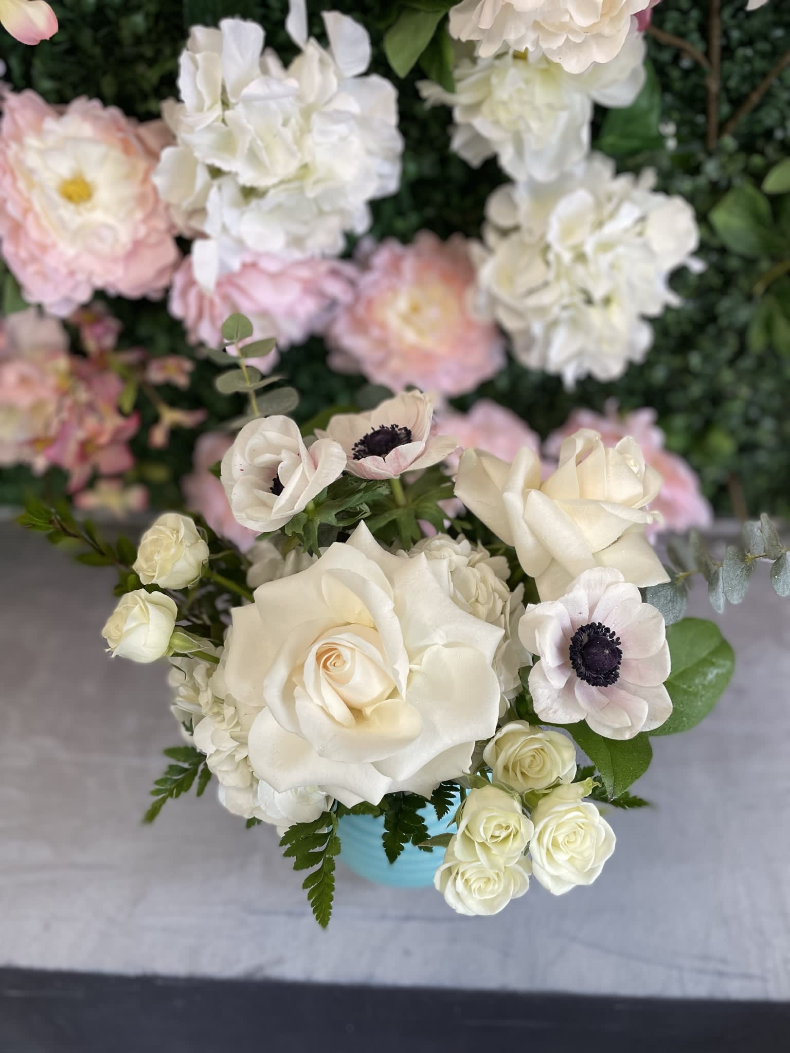 Bee  - This perfect gift has some gorgeous white flowers, white hydrangea, white roses, spray roses, and fresh-cut greenery. 