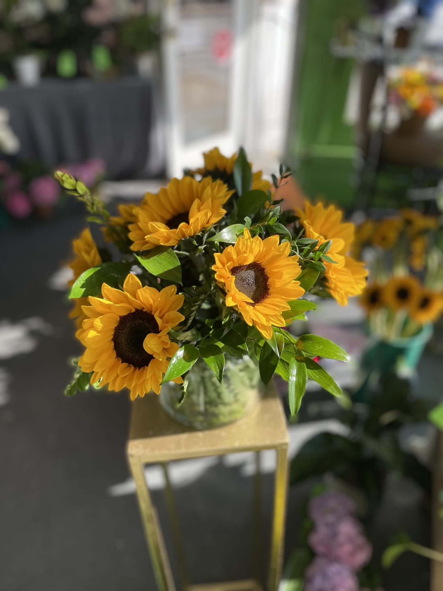 Sunset  - This bright and beautiful arrangement has fresh cut sunflowers.