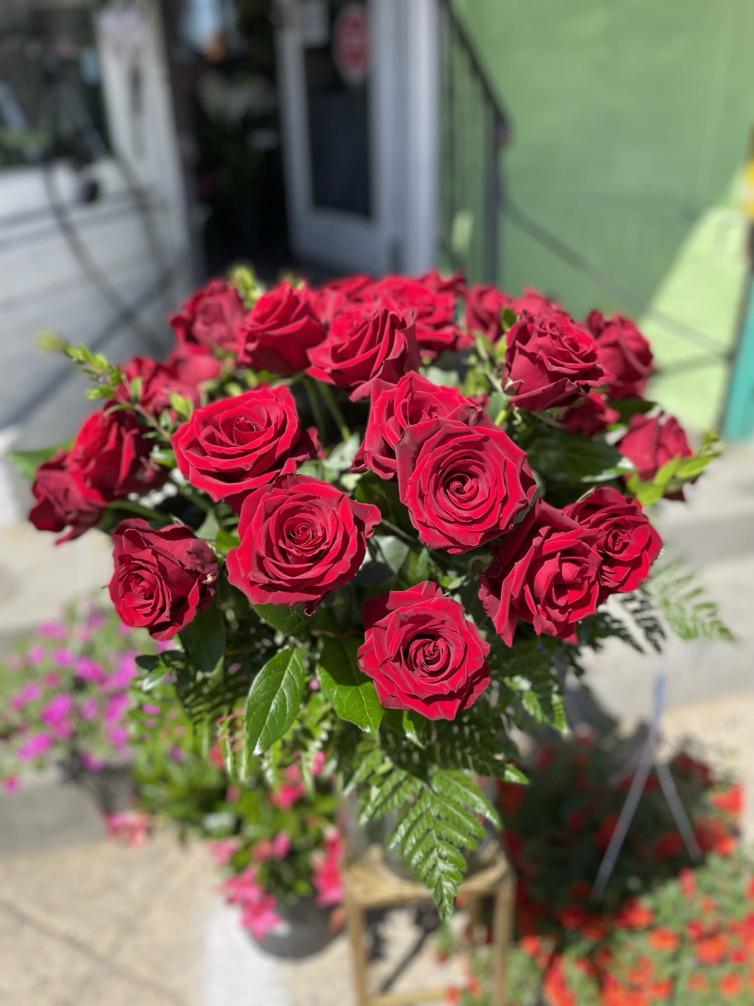 Red Explore  - This gorgeous arrangement has beautiful red roses and fresh cut greens 