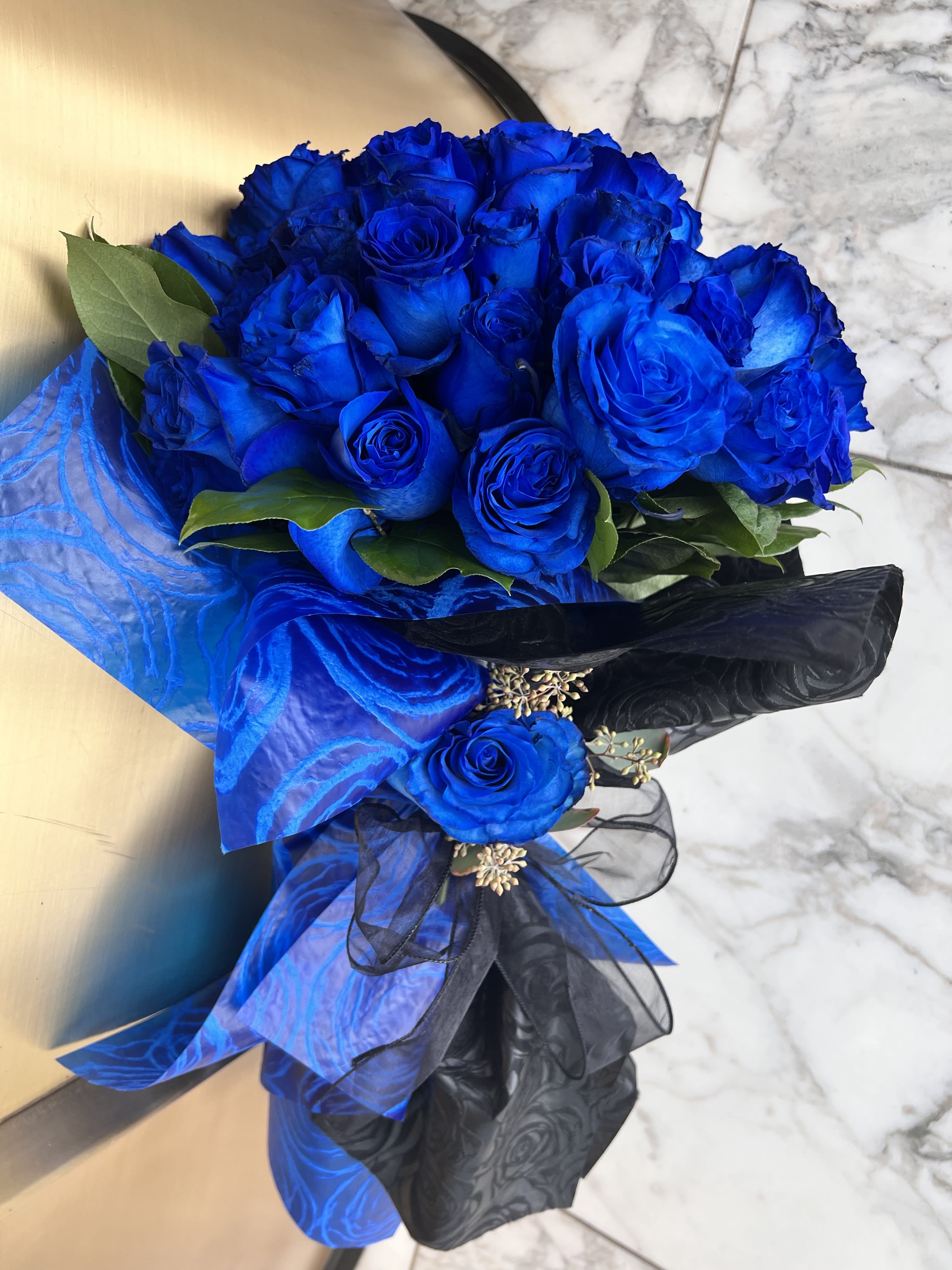 50 Premium Royal Blue Roses - Wrapped bouquet made with 50 premium royal blue roses. It’s a great gift presentation.