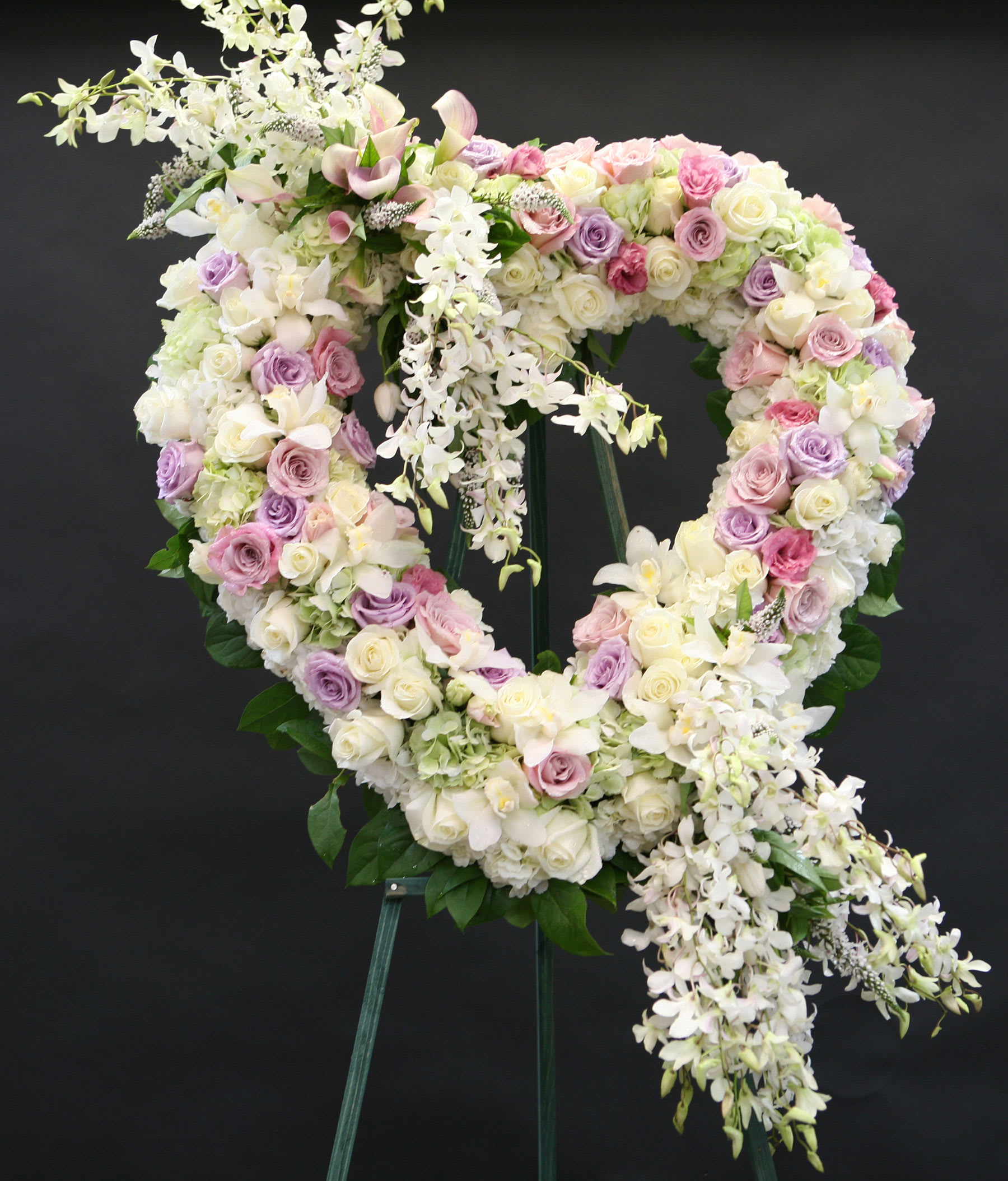 Spirited Heart Wreath with Roses, Lilies & Orchids by Jacob Maarse