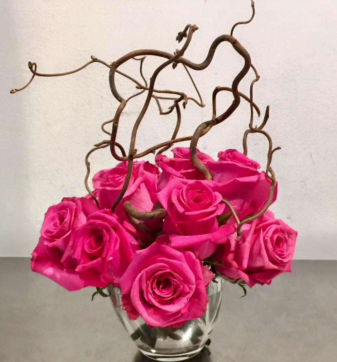 Love Tangles Love Tangles - Arrangement of pinks and branches.