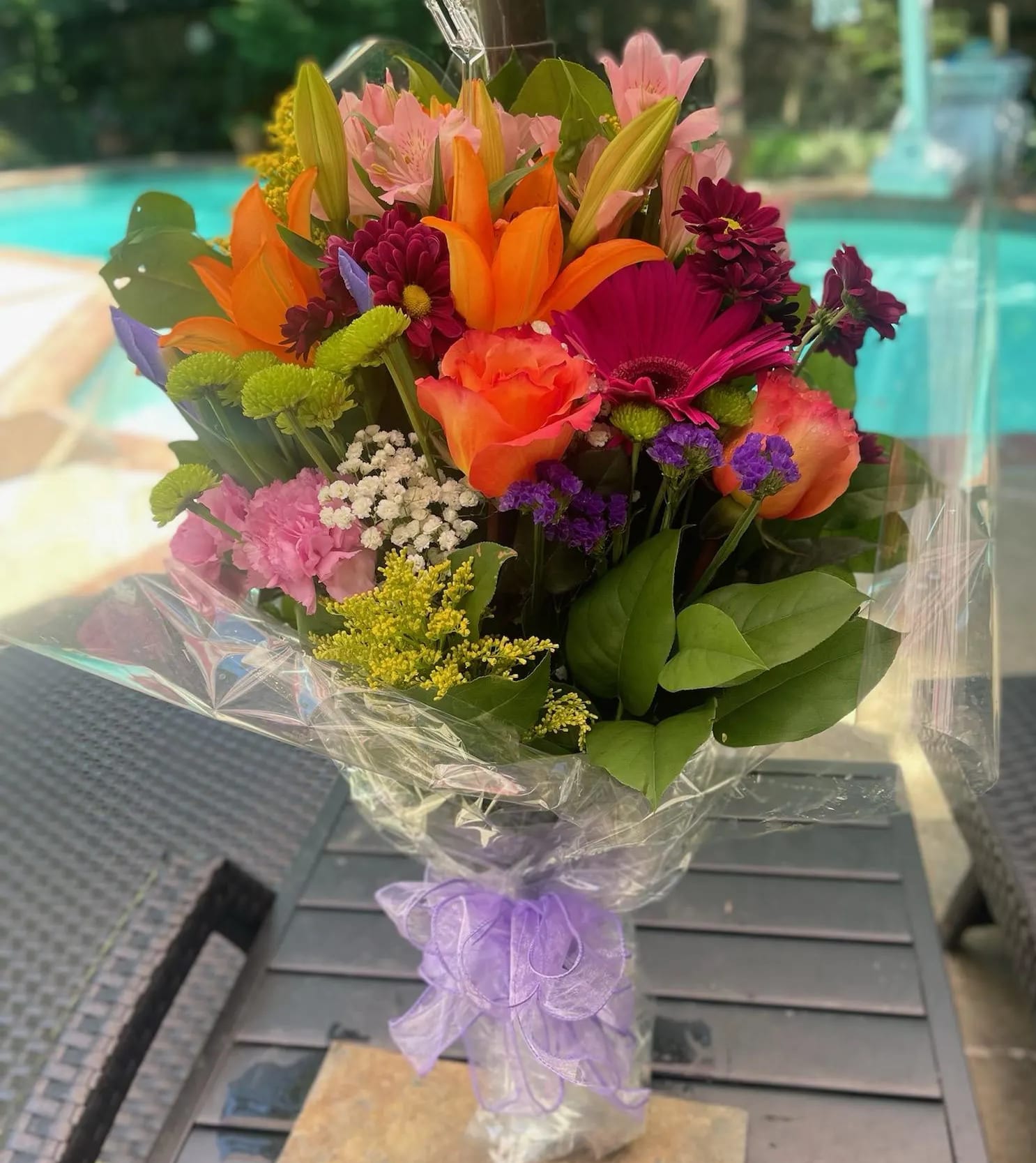 [TT-LFWRAP]:  ASSORTED WRAPPED BOUQUET - WRAPPED BOUQUET OF ASSORTED FLOWERS IN MIXED COLORS